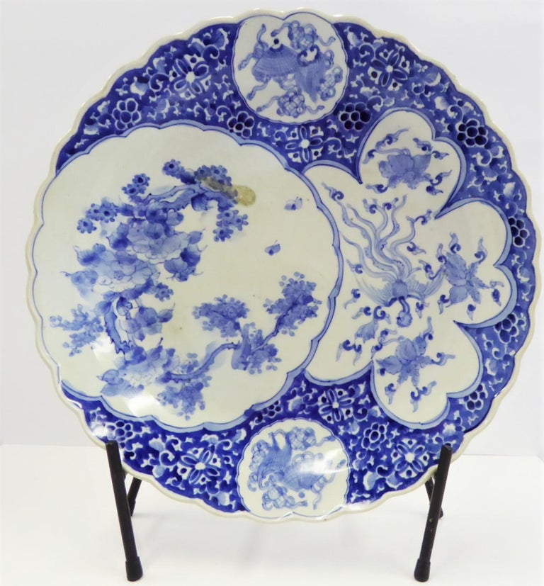 REDUCED FROM $650....Beautiful Meiji Period blue and white Japanese Imari Charger with medallions depicting different scenes and subjects. The scalloped large medallion on left depicting birds perched on a flowering tree. On right medallion a