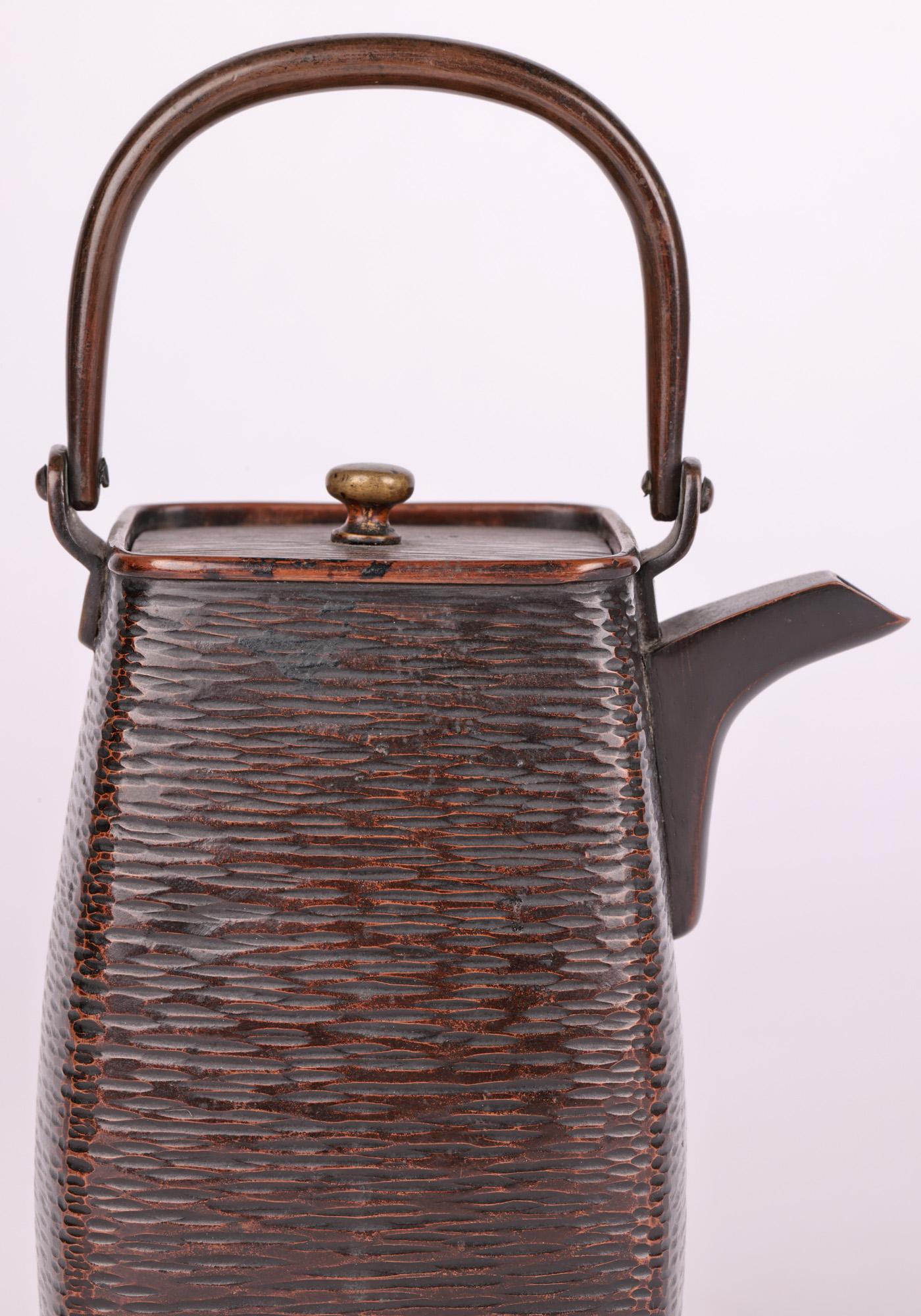 An exceptional quality Japanese Meiji bronze sake pot decorated with a basket weave patterning dating between 1868 and 1912 and probably made around 1890. The pot is elegantly shaped and could immediately be envisaged sitting on a scholar’s desk and