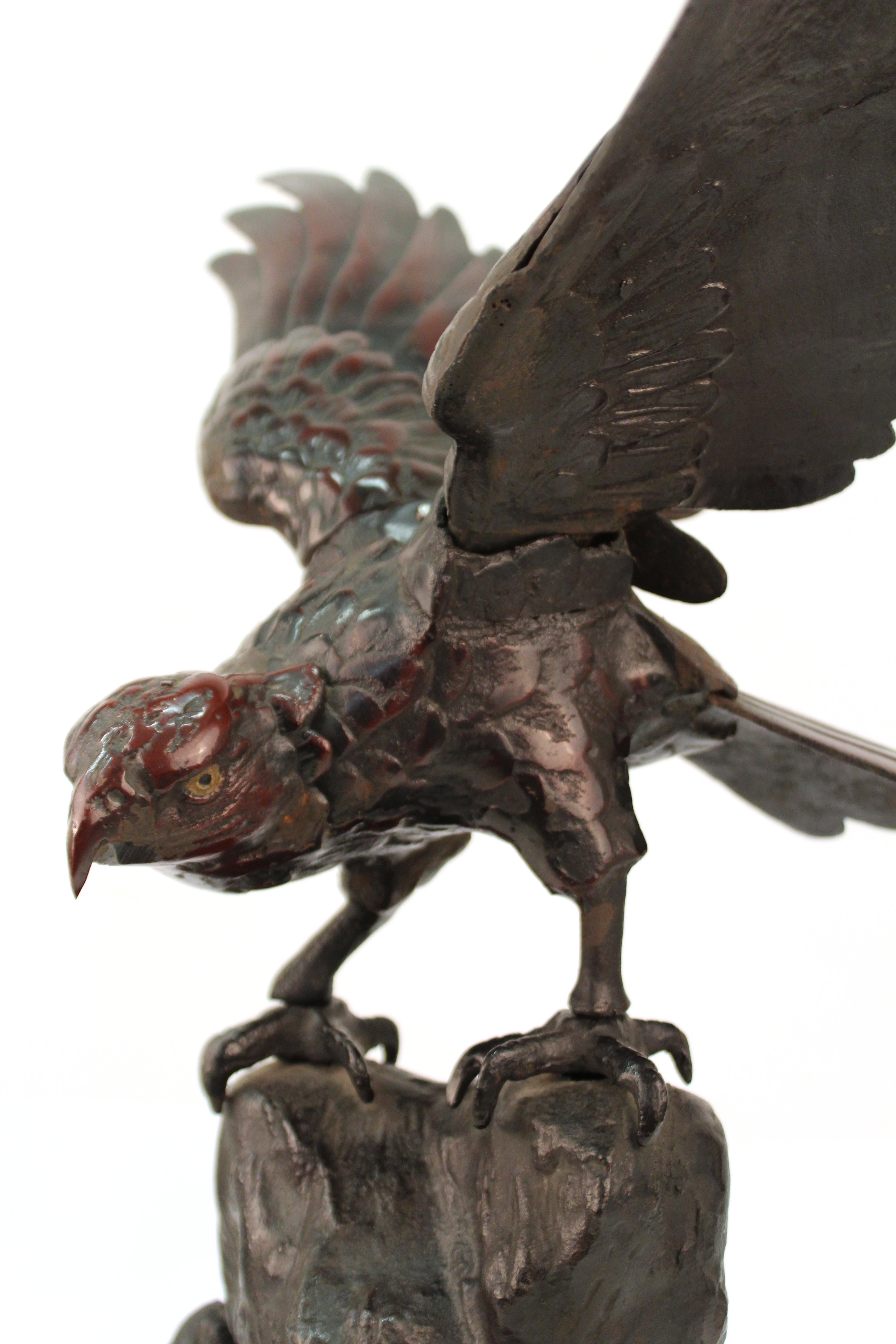 Japanese Taisho period bronze sculpture of an eagle with spread wings atop a rock formation. The piece was made during the early 20th century. In great antique condition with age-appropriate wear and use.
 