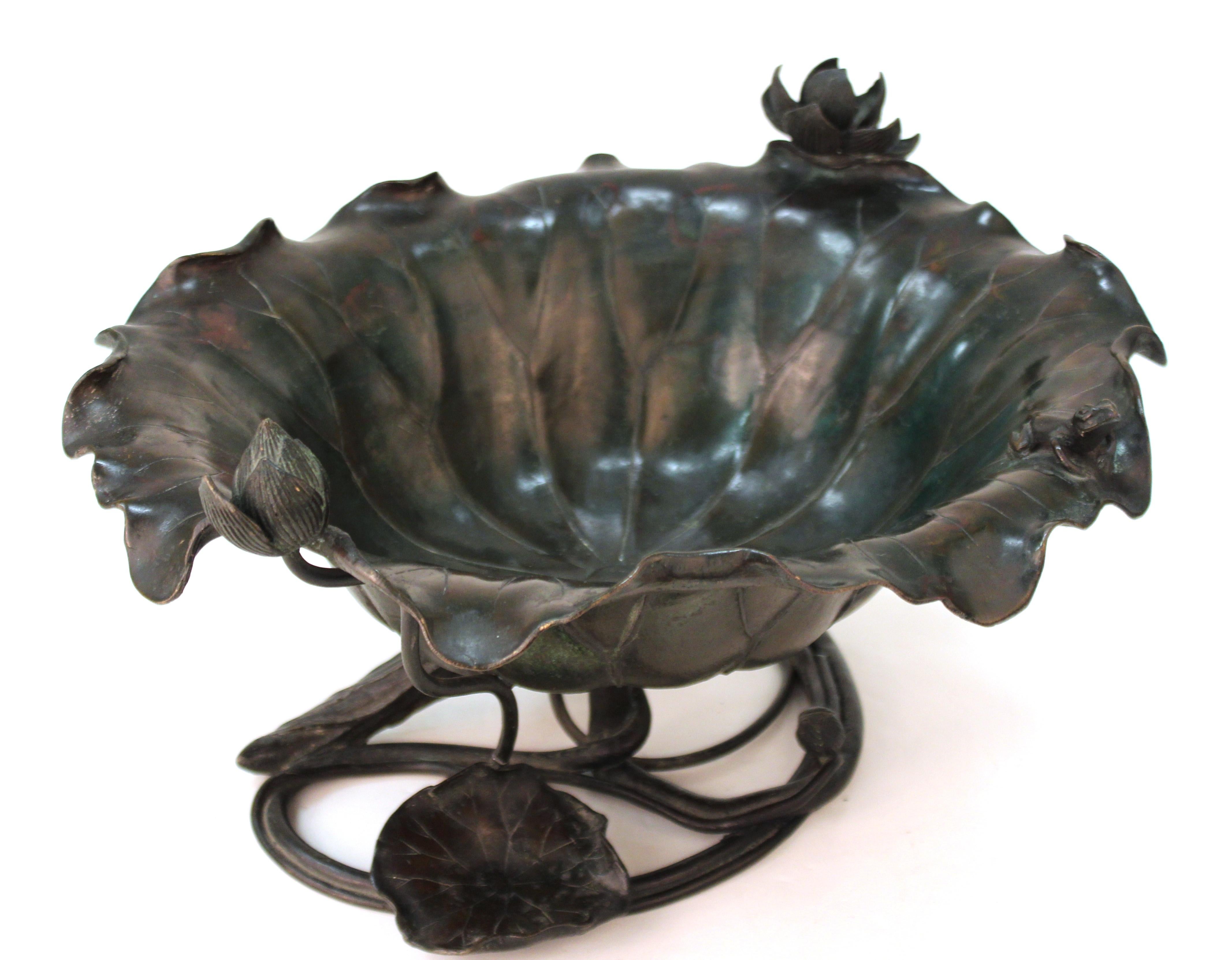 Japanese Meiji period Art Nouveau bronze ikebana vessel or decorative bowl in shape of a leaf, with a lotus flower and a sculpted frog sitting on the edge. The piece is highly detailed and was made in Japan during the 1900s. Mark on the bottom 'Made