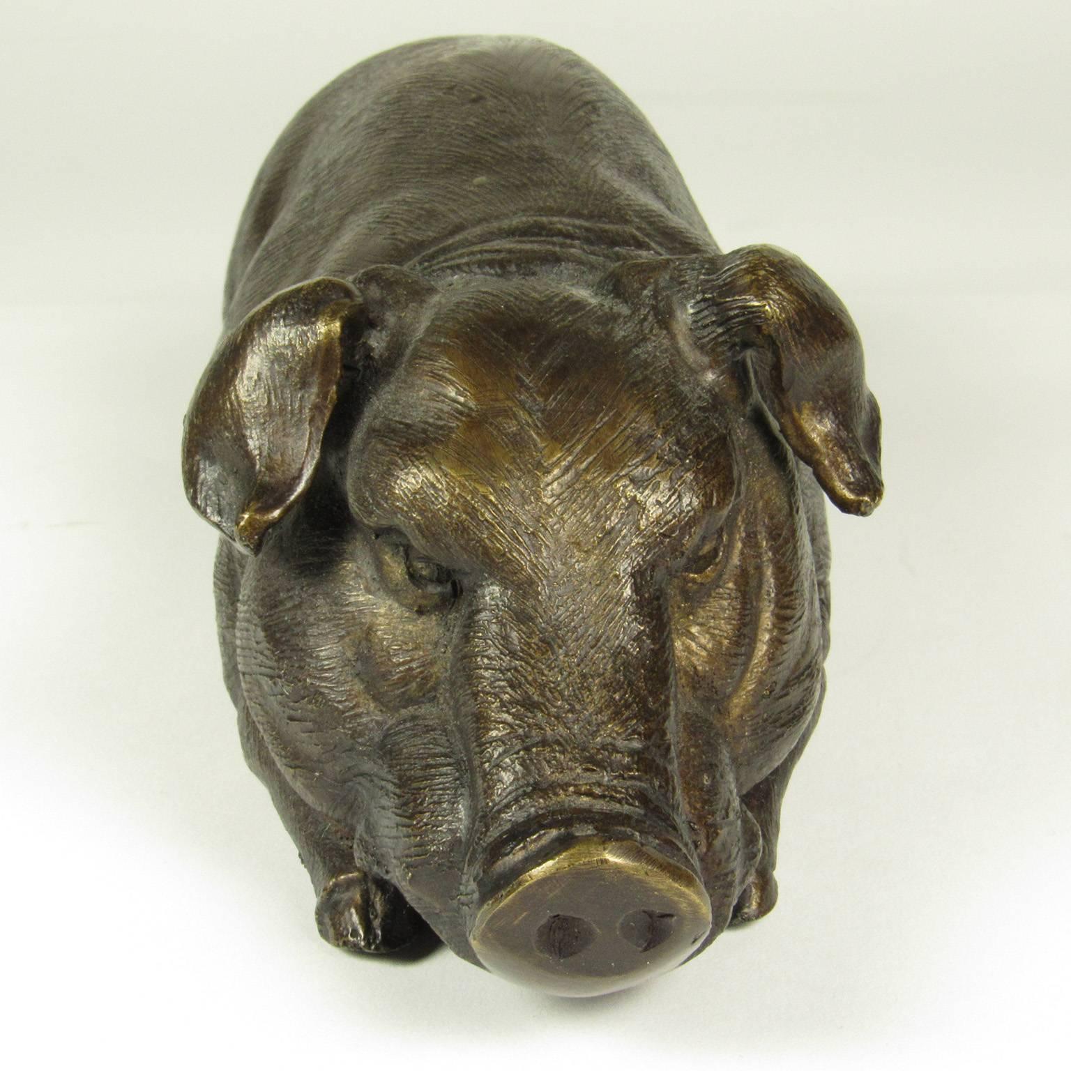 Japanese Meiji bronze sculpture of a pig in reclining position. Length: 12 inches, height: 3 inches, width: 3 1/2 inches.