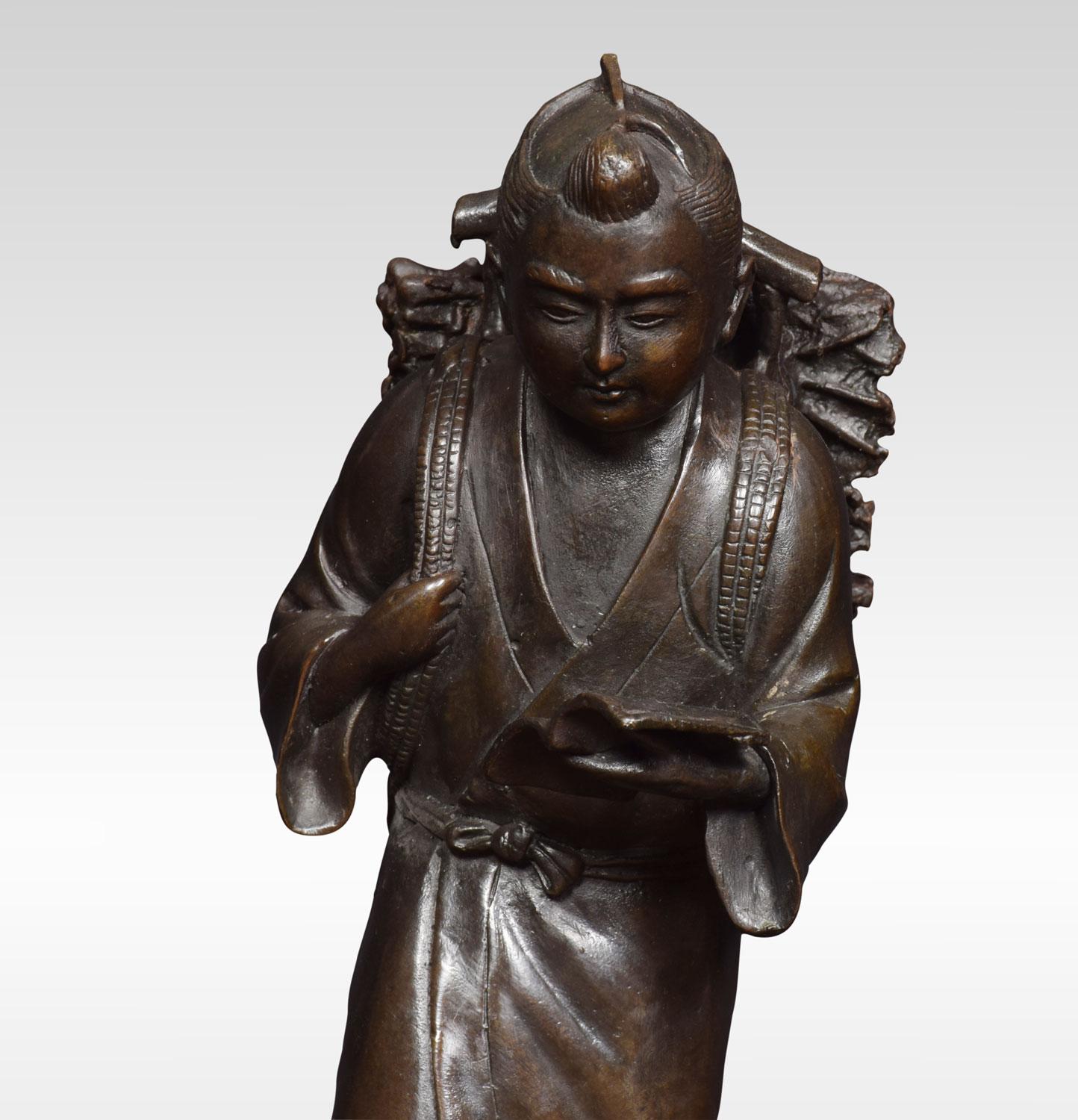 Japanese Meiji Bronze Sculpture of a Woodcutter Reading In Excellent Condition In Cheshire, GB