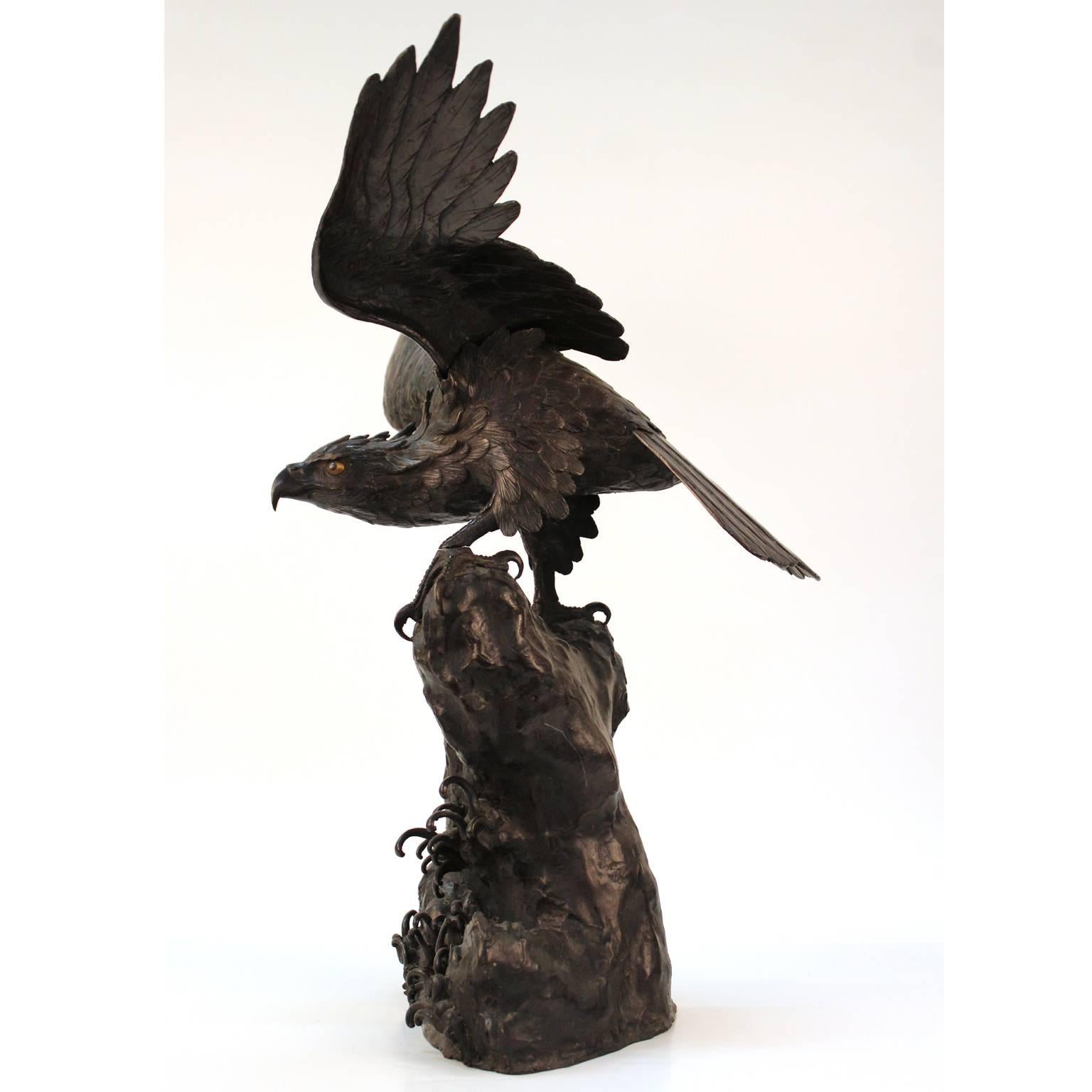 A finely-cast large Japanese Meiji-period bronze sculpture of a sea-hawk with stretched-out wings, made in the 1880s. The eyes are gilded; both wings and the body of the hawk are detachable. No signature; each piece has a 