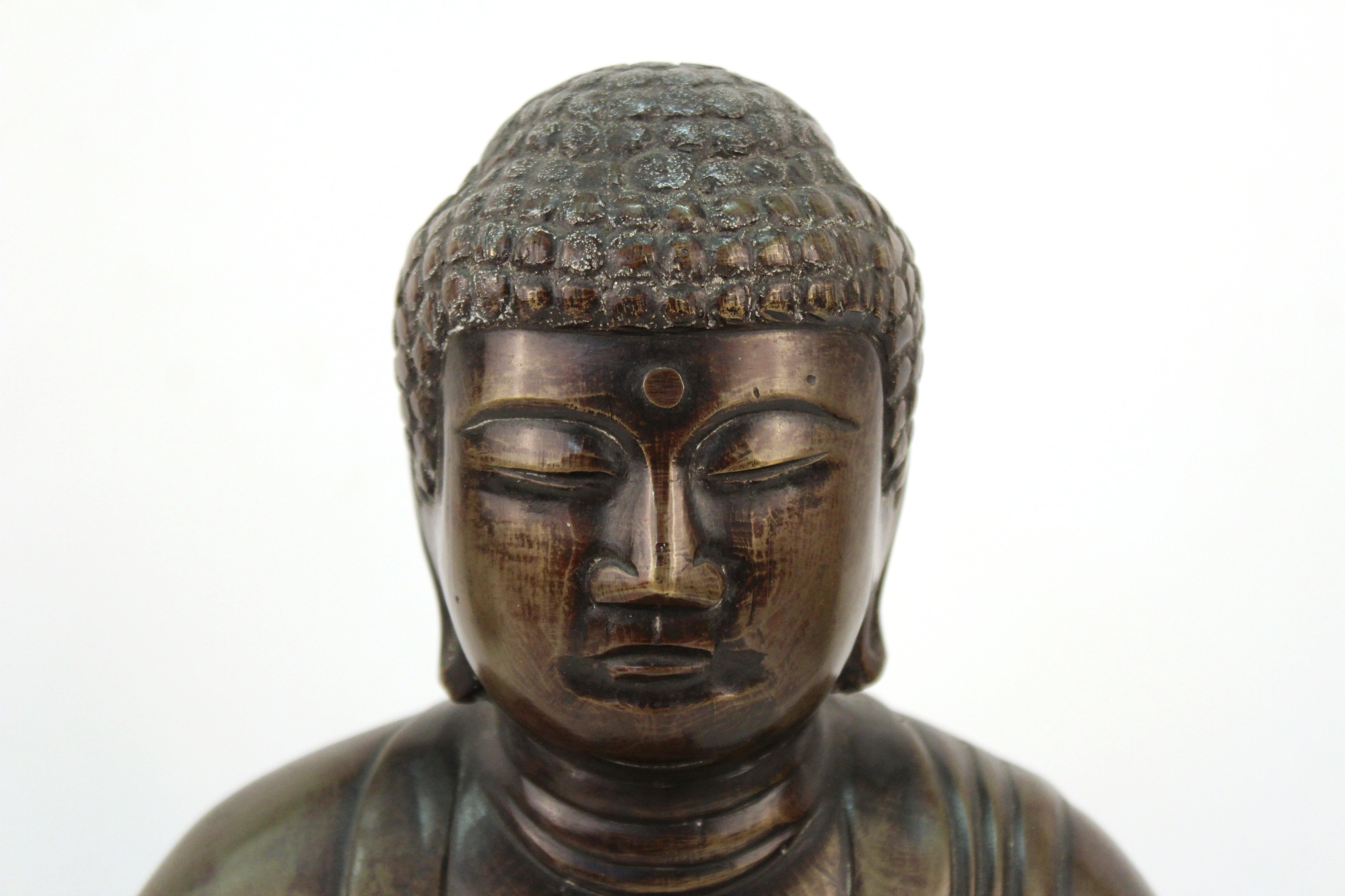 Japanese bronze sculpture of a Buddha in seated position. The piece was made during the mid-20th century. From a private collection in Vancouver. In great antique condition with age-appropriate wear and use.