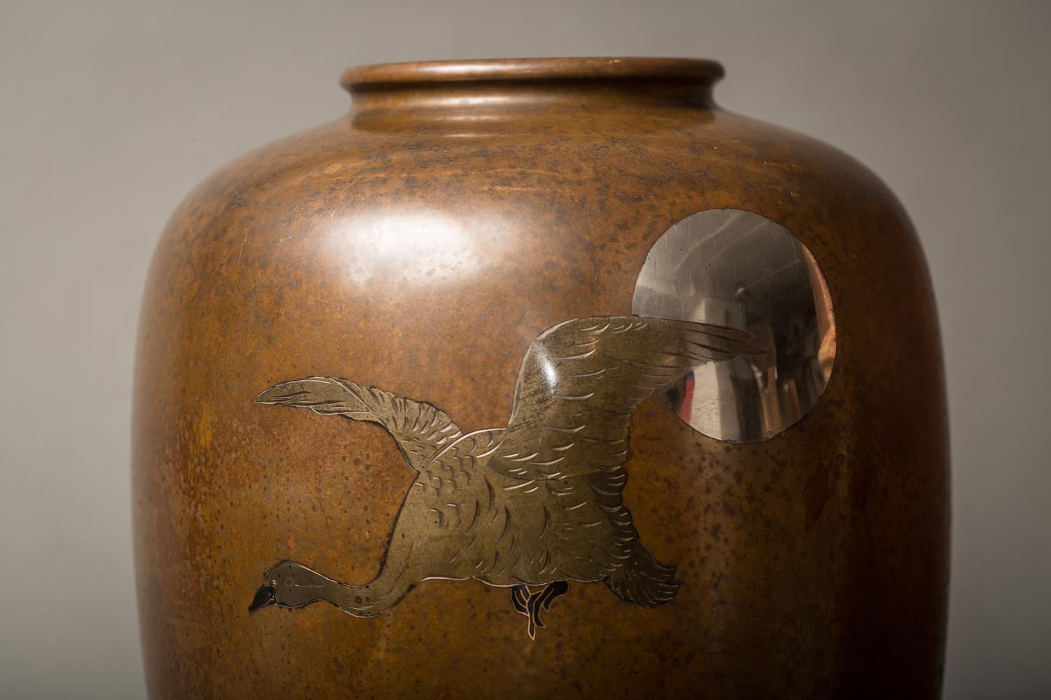 Japanese Meiji bronze Takaoka vase with waterfowl and moon design
Meiji period (1868-1912) bronze vase from Takaoka, in Toyama prefecture, is a city historically known for its metal work. Vase has silver inlay moon and waterfowl, signature on the