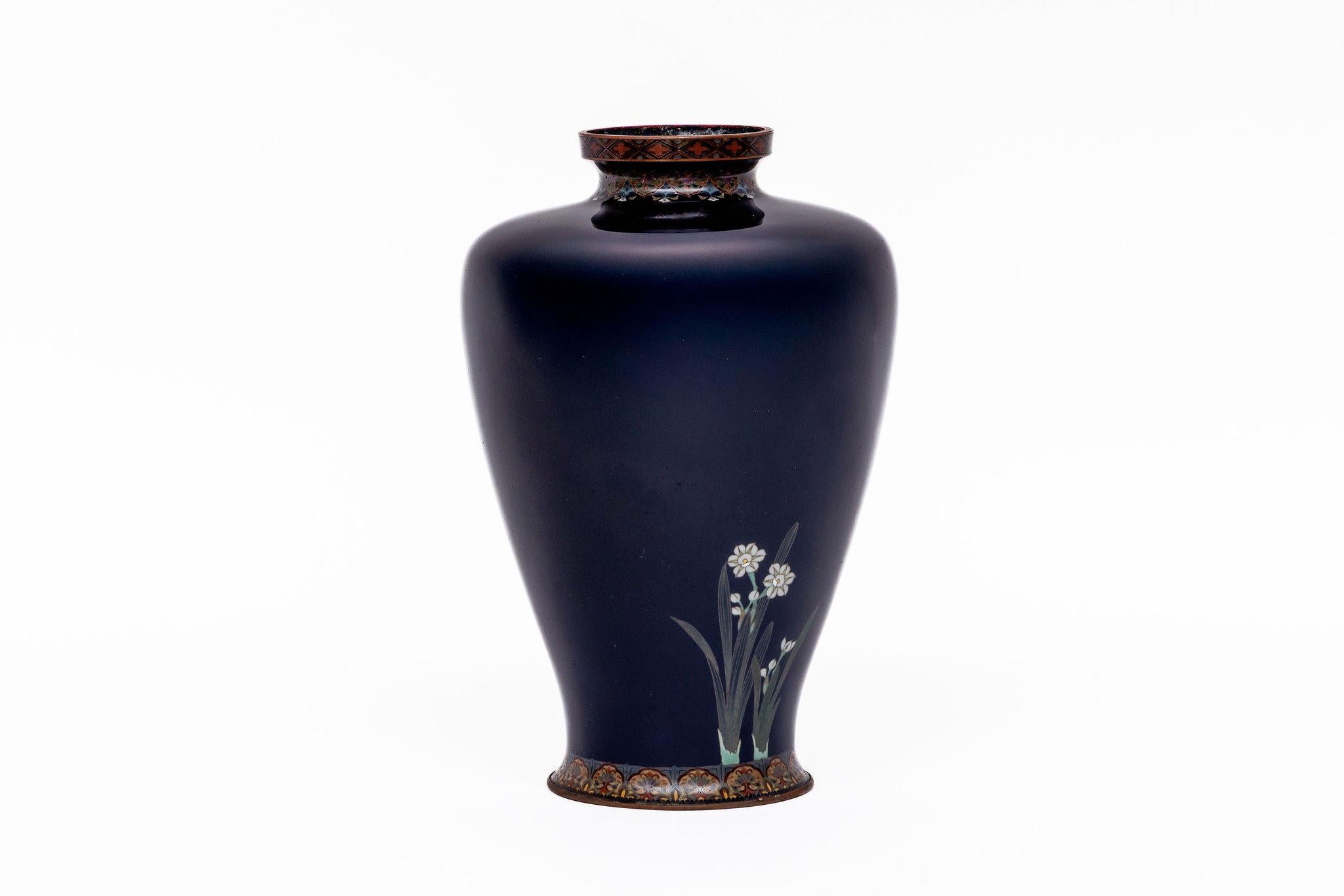 A Japanese Meiji Period Silver-Wire Cloisonné Enamel Vase with Cherry Blossoms and Narcissus, Attributed to Ota Tamashiro

An elegant Japanese cloisonné enamel vase from the Meiji period, attributed to the esteemed Ota Tamashiro workshop, celebrated
