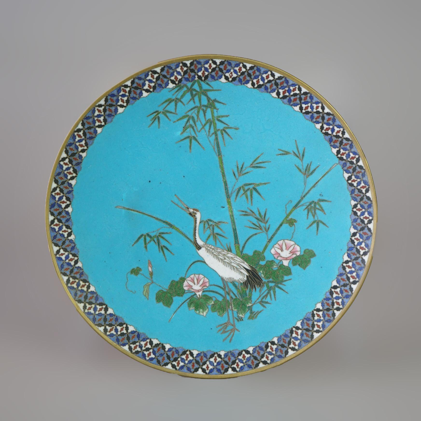 A Japanese Meiji figural charger offers cloisonne enameled metal construction with marsh scene and heron, 20th century

Measures - 1.25