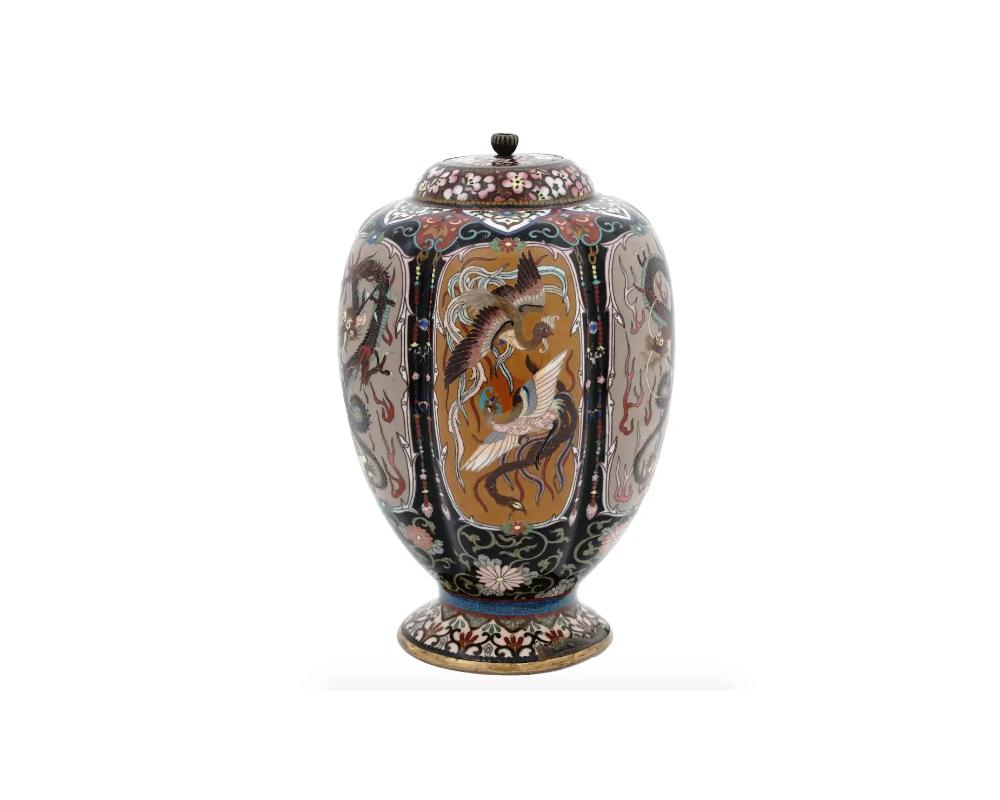 An antique Japanese copper lidded jar with cloisonne enamel design. Late Meiji period, before 1912. Elongated lobulated shape with pronounced base. The piece is richly decorated with ornamental decor which encompasses medallions with birds and
