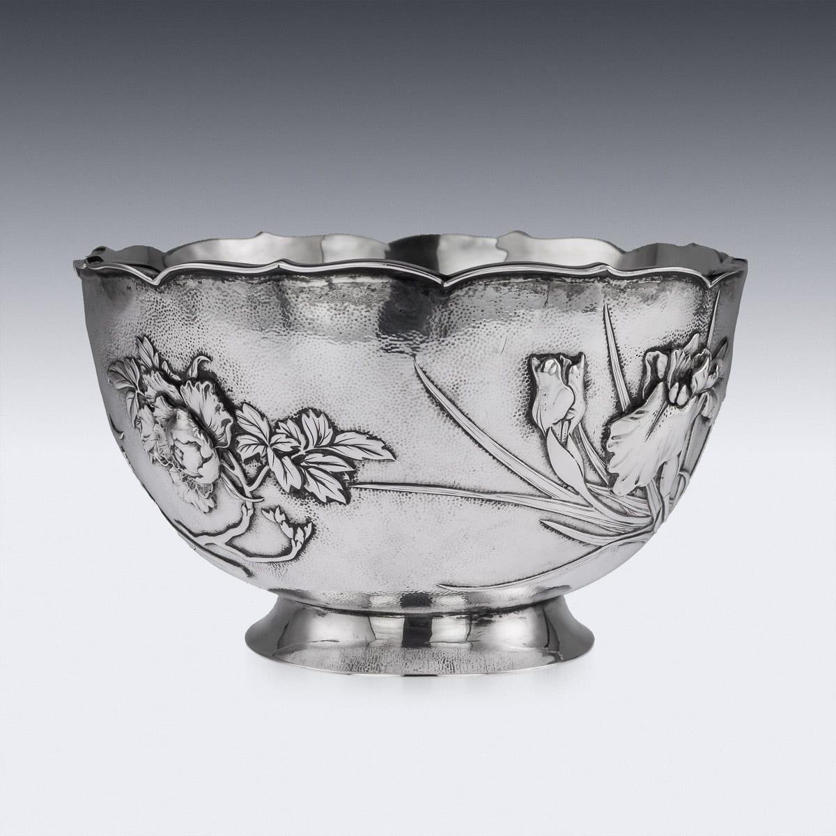 Antique early 20th century Japanese Meiji period solid silver bowl, oval shaped, double walled, chased and embossed with blossoming irises and chrysanthemum in high relief on matted ground, shaped floral rim applied with a pronounced boarder and