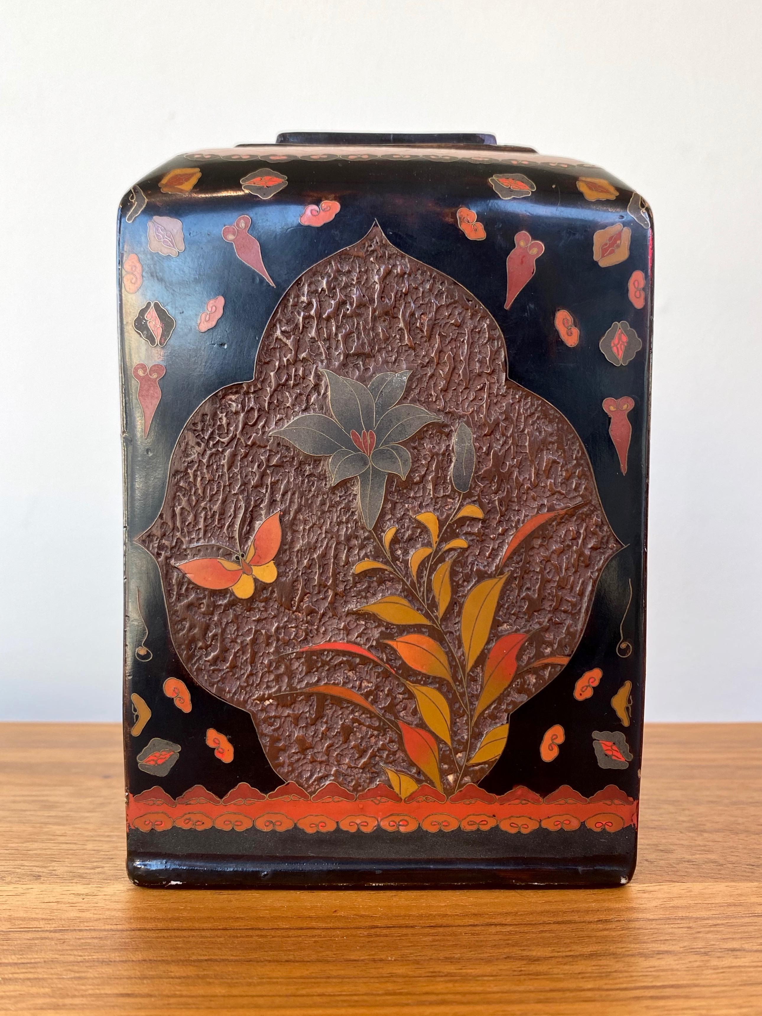 A very charming and warm, vibrantly colored Japanese Meiji period jiki-shippo “tree-bark” cloisonné porcelain vase.

Subtly tapered rectangular form with each side displaying a delightful floral and butterfly vignette on roughly textured lacquered