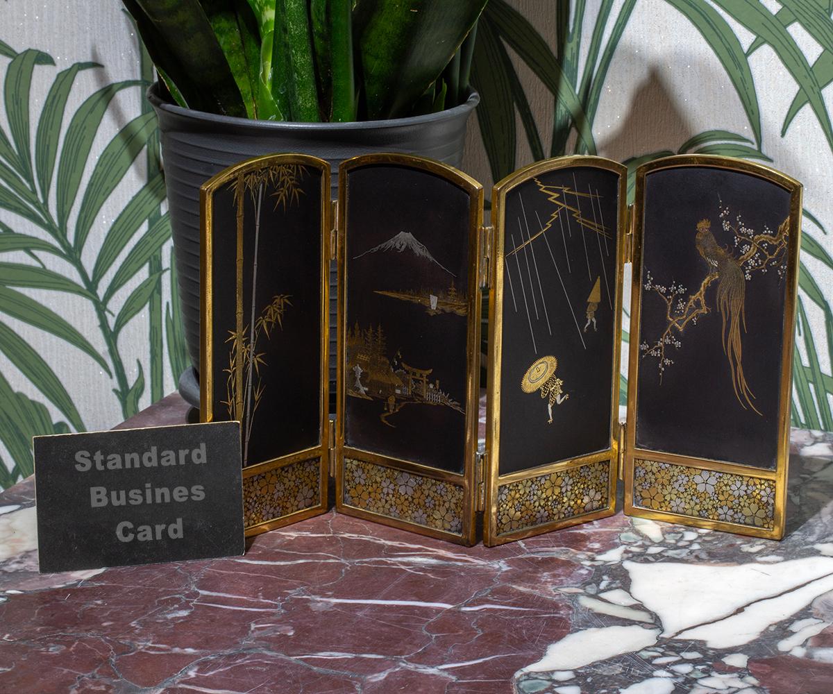 FEATURING FOUR FOLDING PANELS

MEASUREMENTS
16cm High x 29.5cm Wide – each panel 7.15cm (6.3 x 11.6 – 2.81)

From our Japanese collection, we are delighted to introduce this Japanese Damascene Table Screen by Masamitsu. The Table Screen of petit