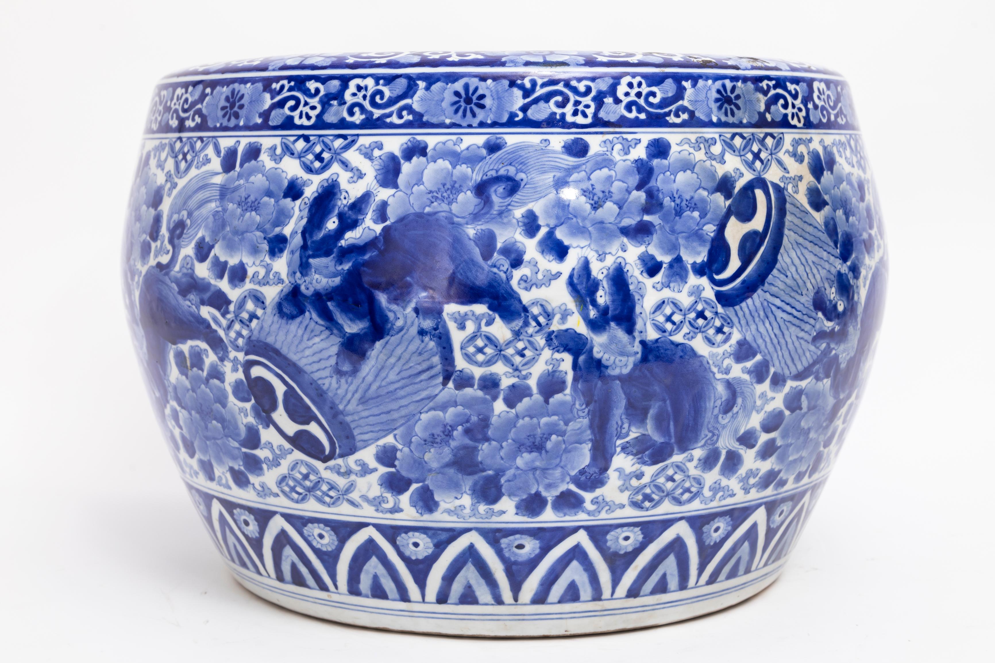Japanese Meiji Period Blue & White Jardiniere with Shishi Dogs & Barrels: 1880

This impressive Japanese porcelain jardiniere, hailing from the Meiji period around 1880, is a testament to the enduring allure of blue and white ceramics. A masterwork