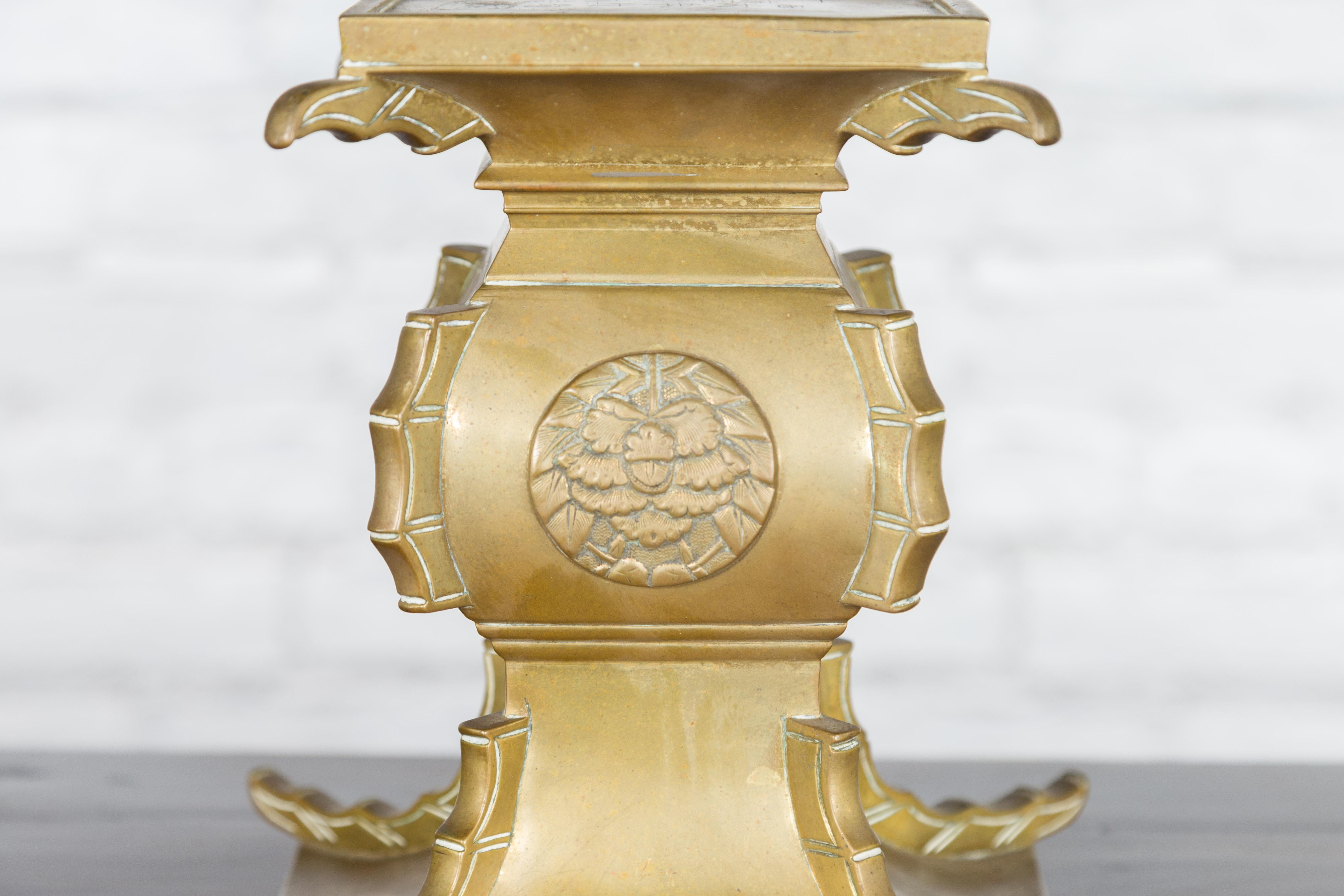 Japanese Meiji Period Brass Candle Holder with Scrolls and Medallions For Sale 7