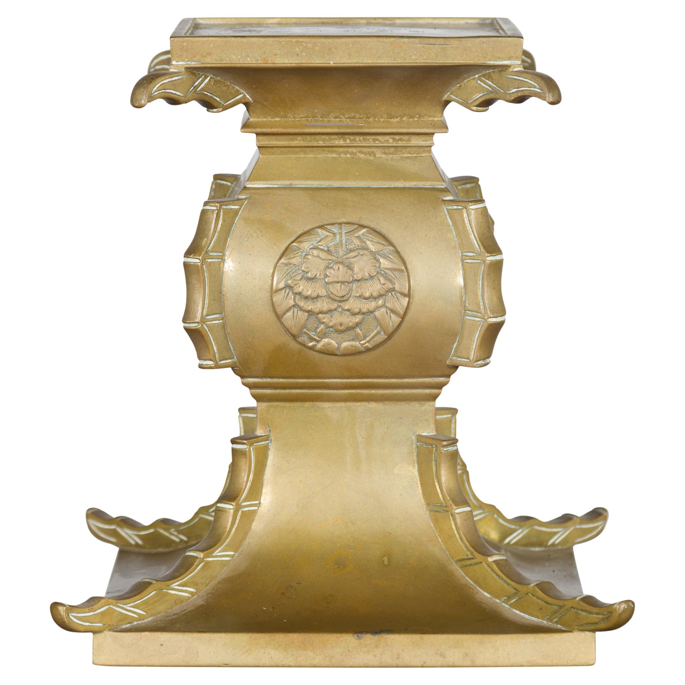 Japanese Meiji Period Brass Candle Holder with Scrolls and Medallions