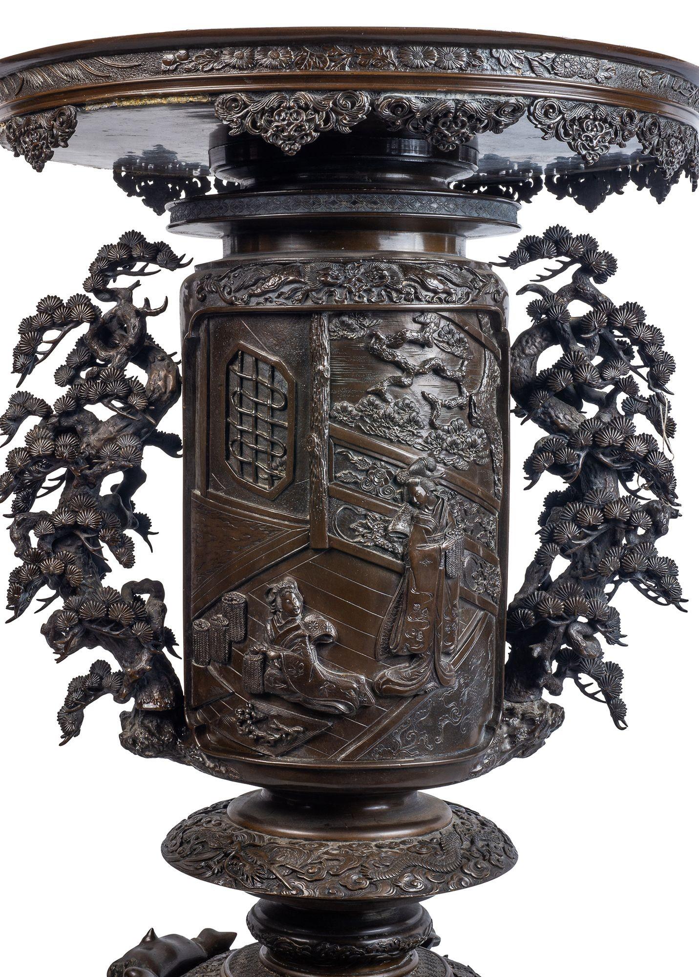A very impressive and decorative Japanese Meiji period (1868-1912) bronze Censor, having wonderful stylised tree like handles either side, inset panels depicting two Geisha girls on a terrace, exotic birds, trees to the reverse. The whole supported