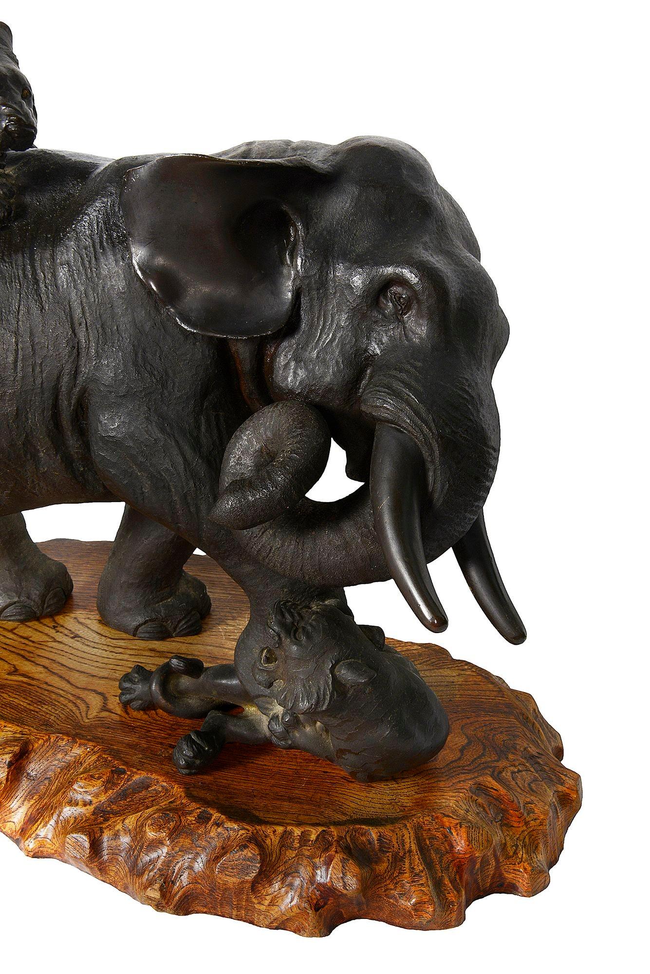Japanese Meiji period bronze Elephant fighting two Lions. In Good Condition For Sale In Brighton, Sussex