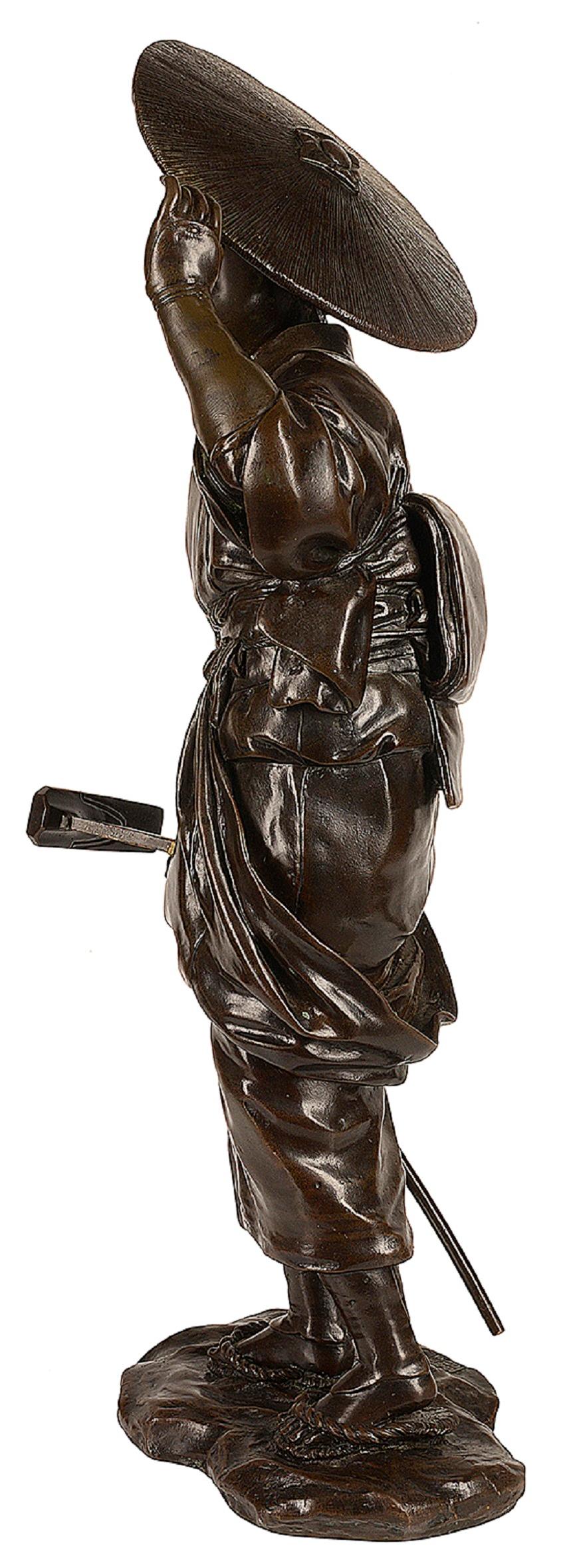 A very good quality late 19th Century (Meiji period 1868-1912) Japanese bronze statue of a farm girl holding a Hoe and wearing a wide brimmed wicker hat.
Signed on the base.