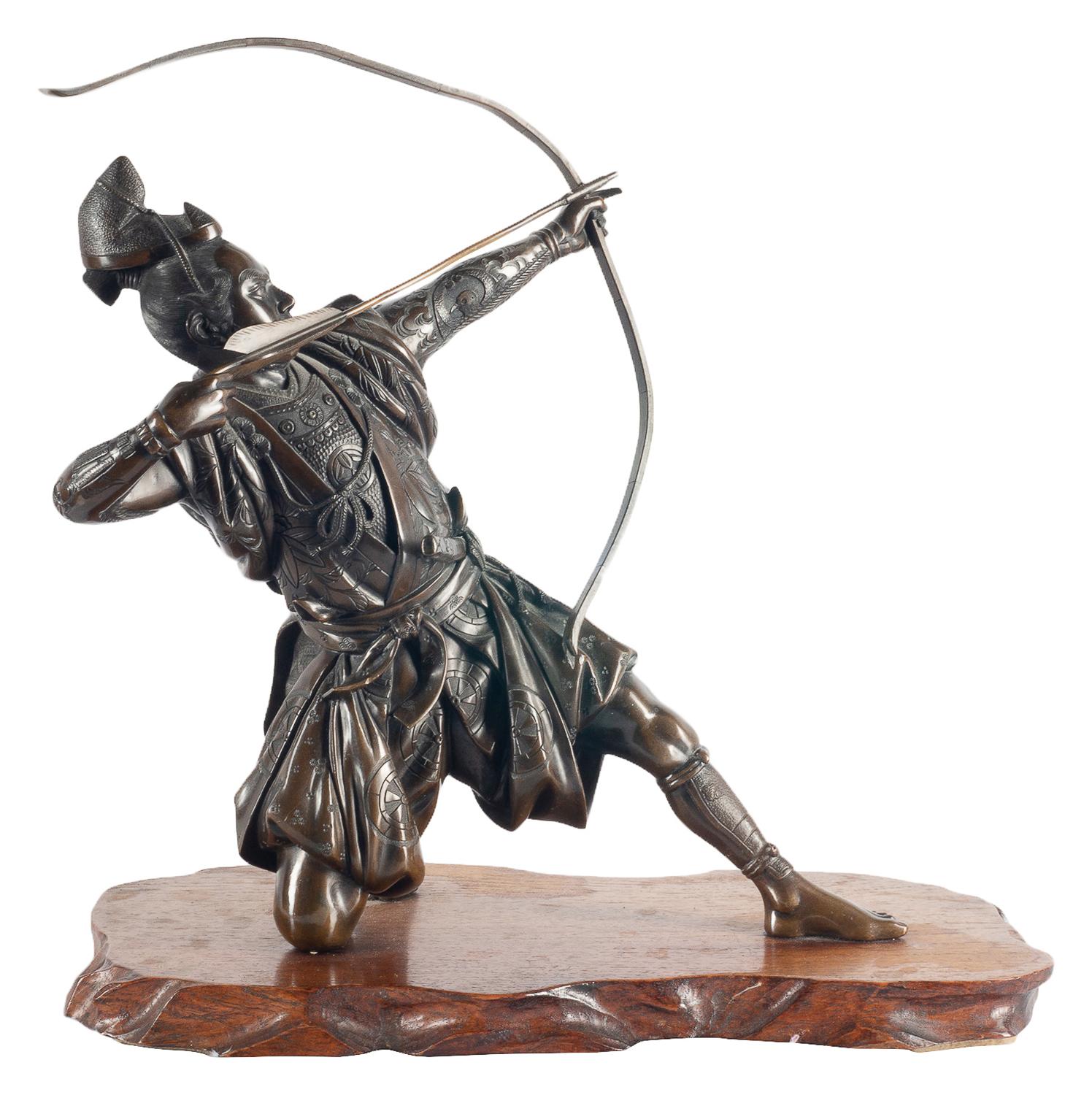 A very good quality 19th century Japanese Meiji period (1868-1912) Miayo style bronze Samurai warrior firing a bow and arrow and mounted on a root wood base.