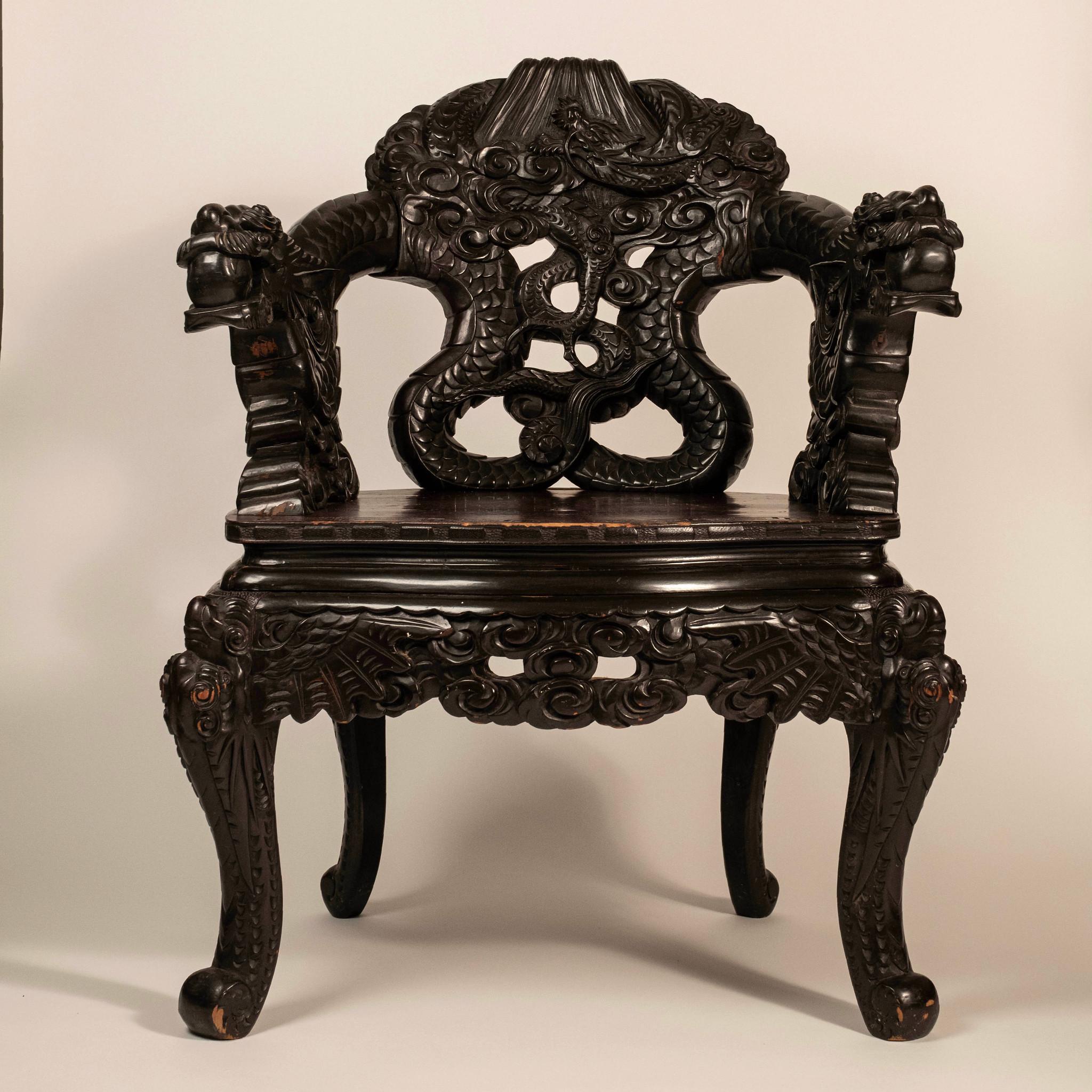 Highly carved sculptural Meiji dragon armchair.: dragon motif carried throughout arms and chair with fantastic detailed hand carvings.