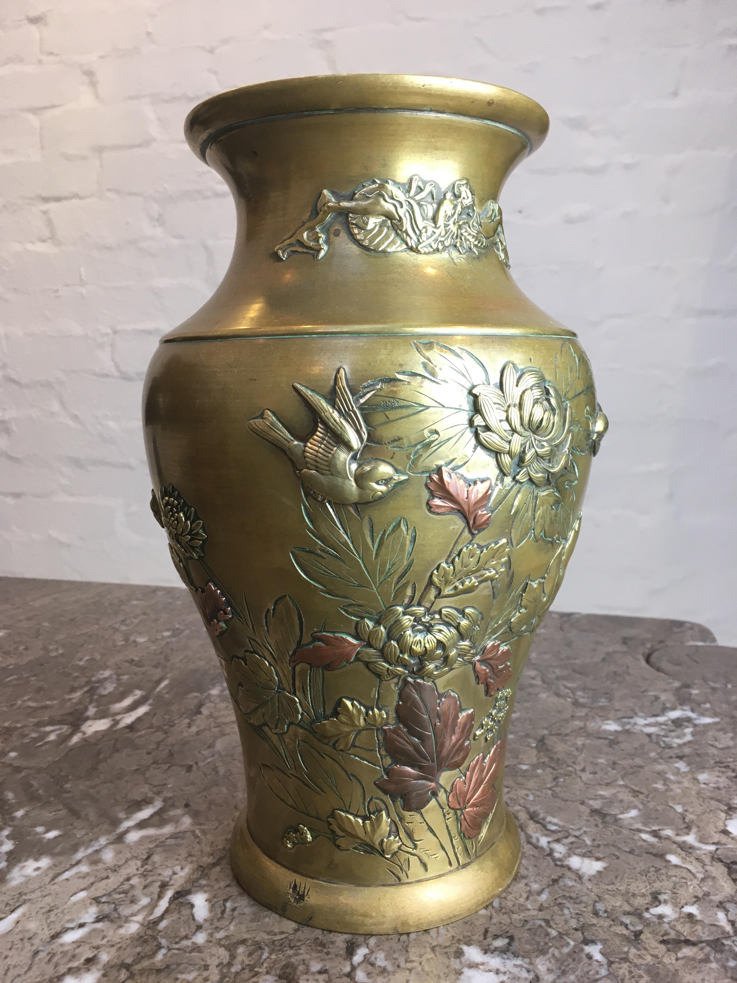 A delightful Japanese mixed metal vase for everyday use. The beautiful patina which develops with age in Meiji mixed metal has, sadly, been removed by a previous owner’s overzealous polishing. However, this allows us to present a vase for everyday