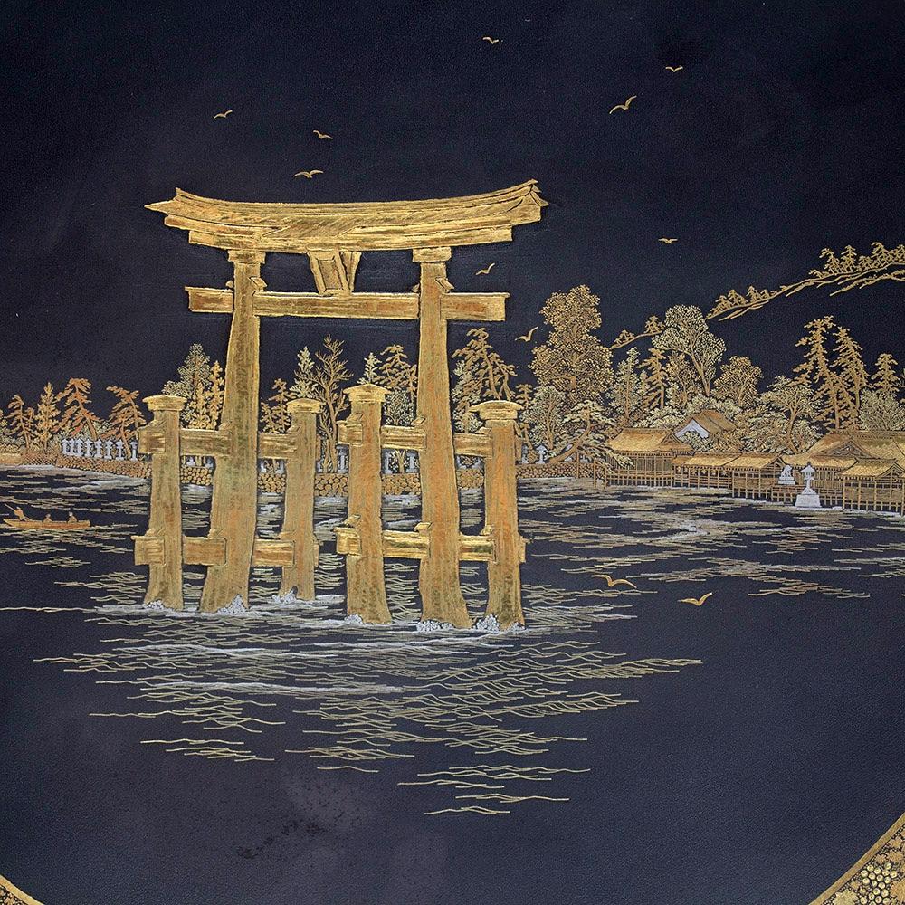Fine Japanese iron charger dating to the late Meiji period. The charger boldly decorated with an outer boarder of gilt leaves surrounding the central scene of the world-famous Itsukushima Shrine also known as the Great Torii of Miyajima. The charger