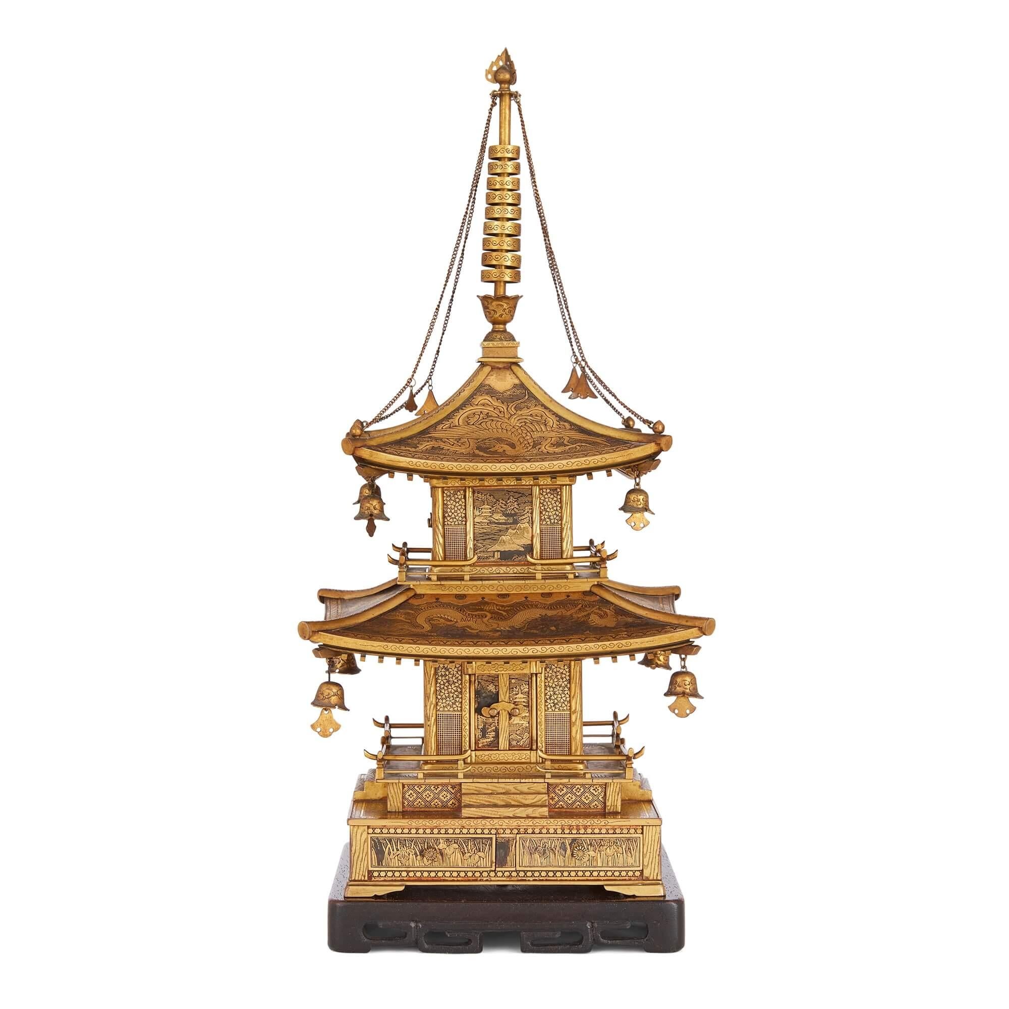 Japanese Meiji period Komai inlaid-iron pagoda model
Japanese, Late 19th Century 
Temple: Height 33cm, width 15cm, depth 15cm
Base: Height 2 cm, width 13.5cm, depth 13.5cm
Together: Height 35cm, width 15cm, depth 15cm

This outstanding and extremely
