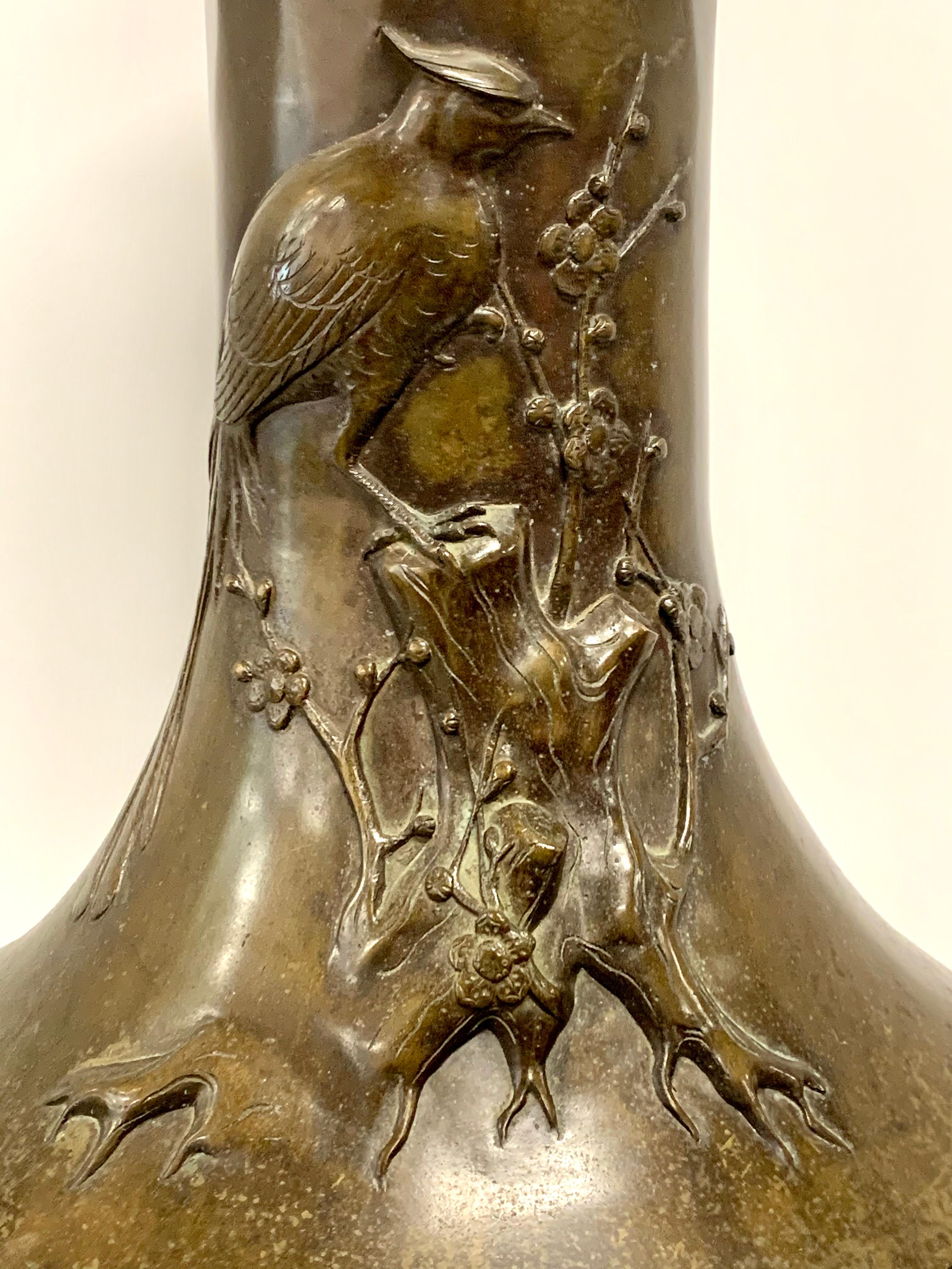 A beautiful Japanese Bronze vase from the Meiji period we believe. Early 20th Century. Nice scale and form. It is slightly over 24 inches tall.  Crisp casting and nice detail. 
The bronze has quite a bit of patina loss and appears to have been