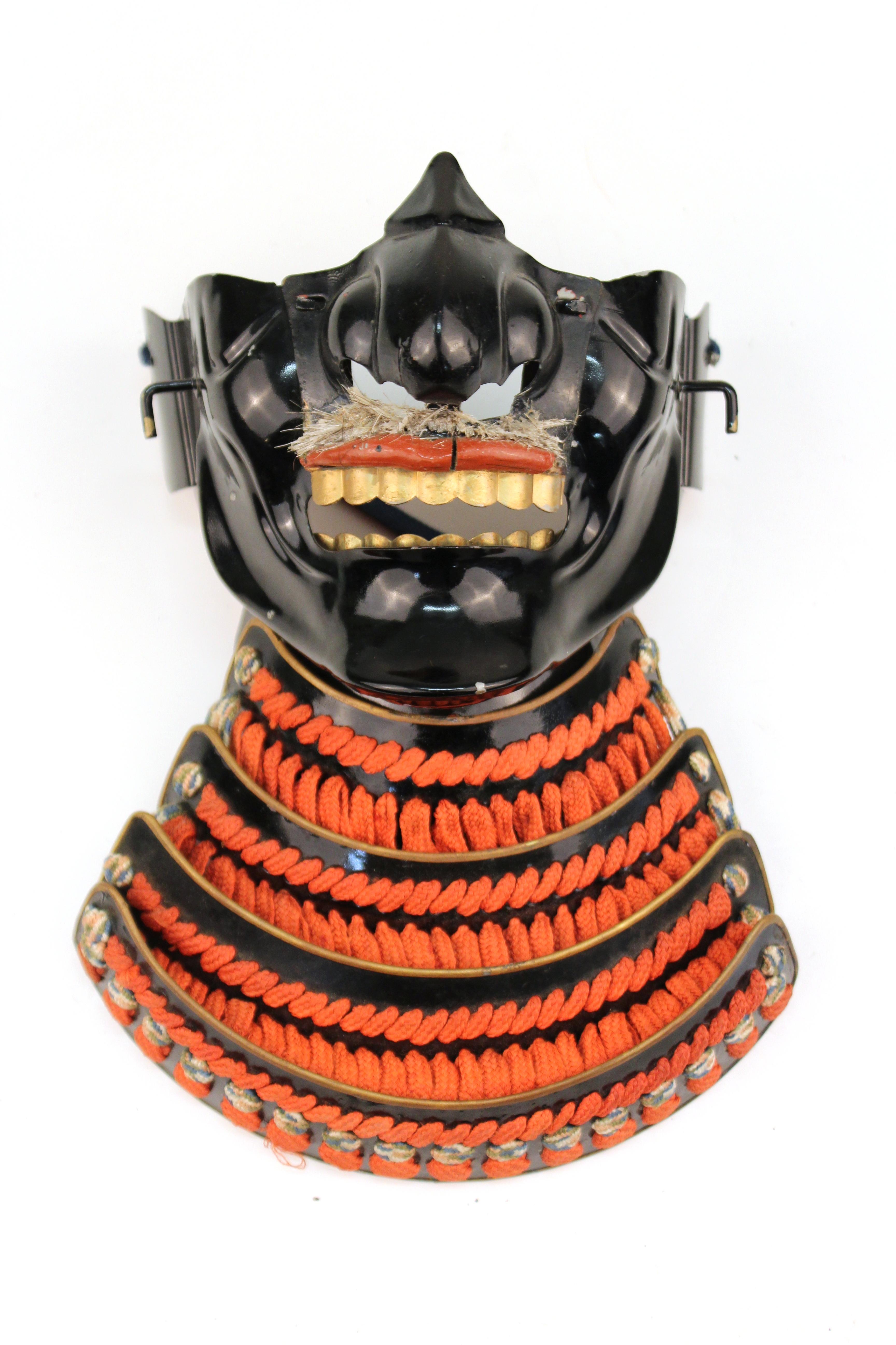 Japanese Meiji period samurai half-face mask with mustache, made in circa 1900 in Japan. In good vintage condition with age-appropriate wear and patina.
 