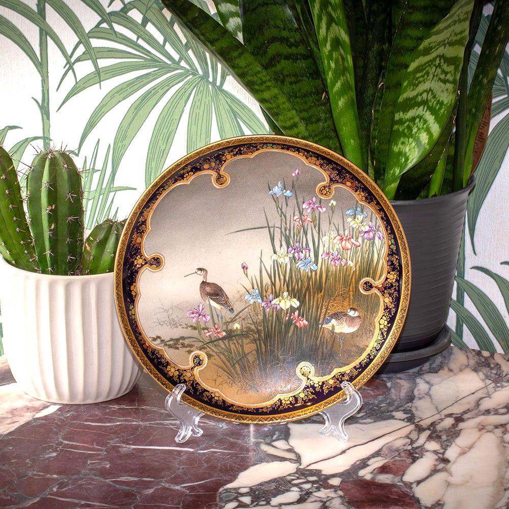 Painted with Two Snipe Amongst Iris

From our Japanese collection, we are delighted to offer this Japanese Meiji Period Satsuma Plate by Kinkozan. The Satsuma Plate is extensively decorated with a central scene featuring two common snipe birds stood