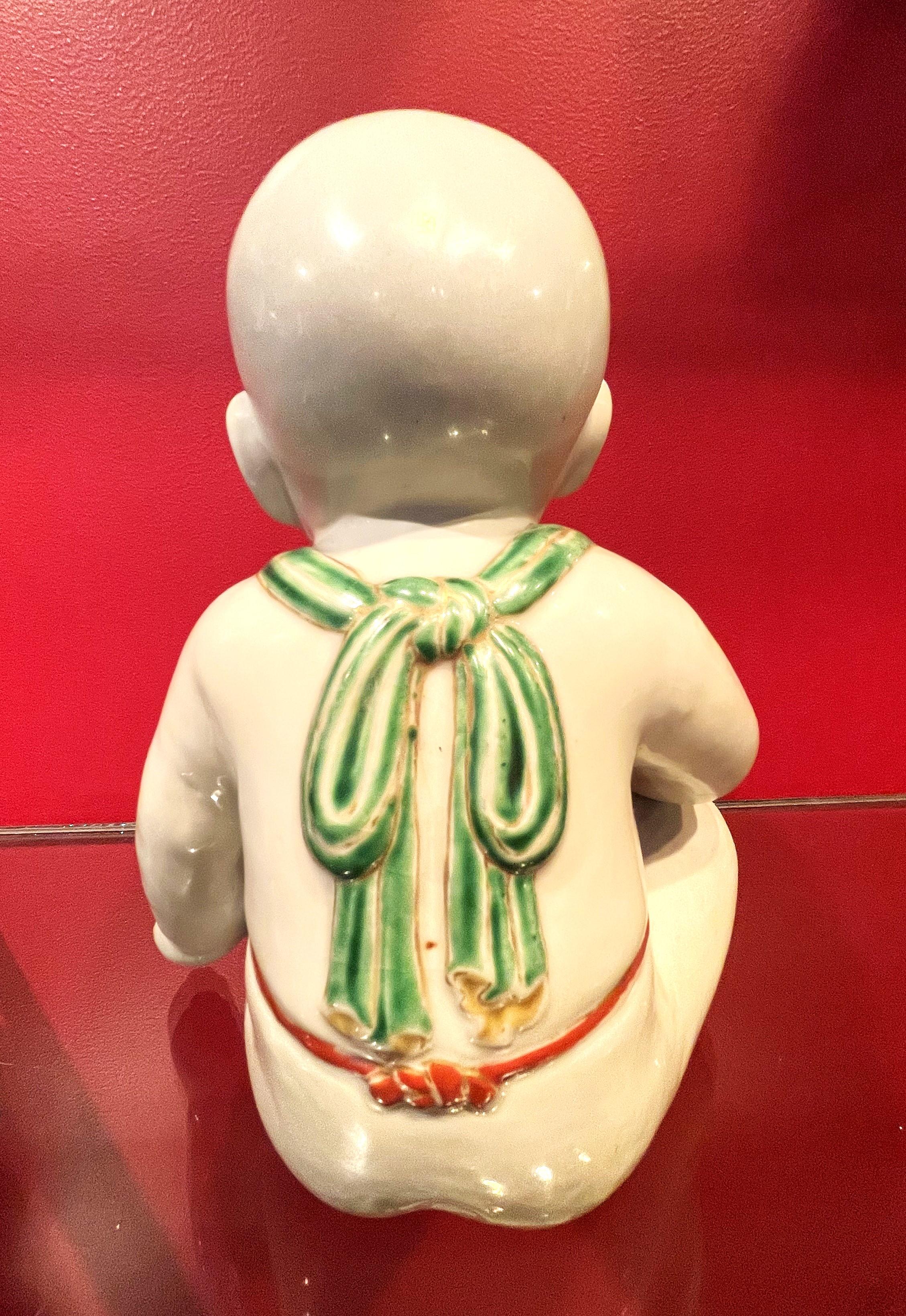 Japonisme Japanese Meiji Porcelain Figurine of Boy Holding a Green Whistle Bird, Ca. 1890 For Sale