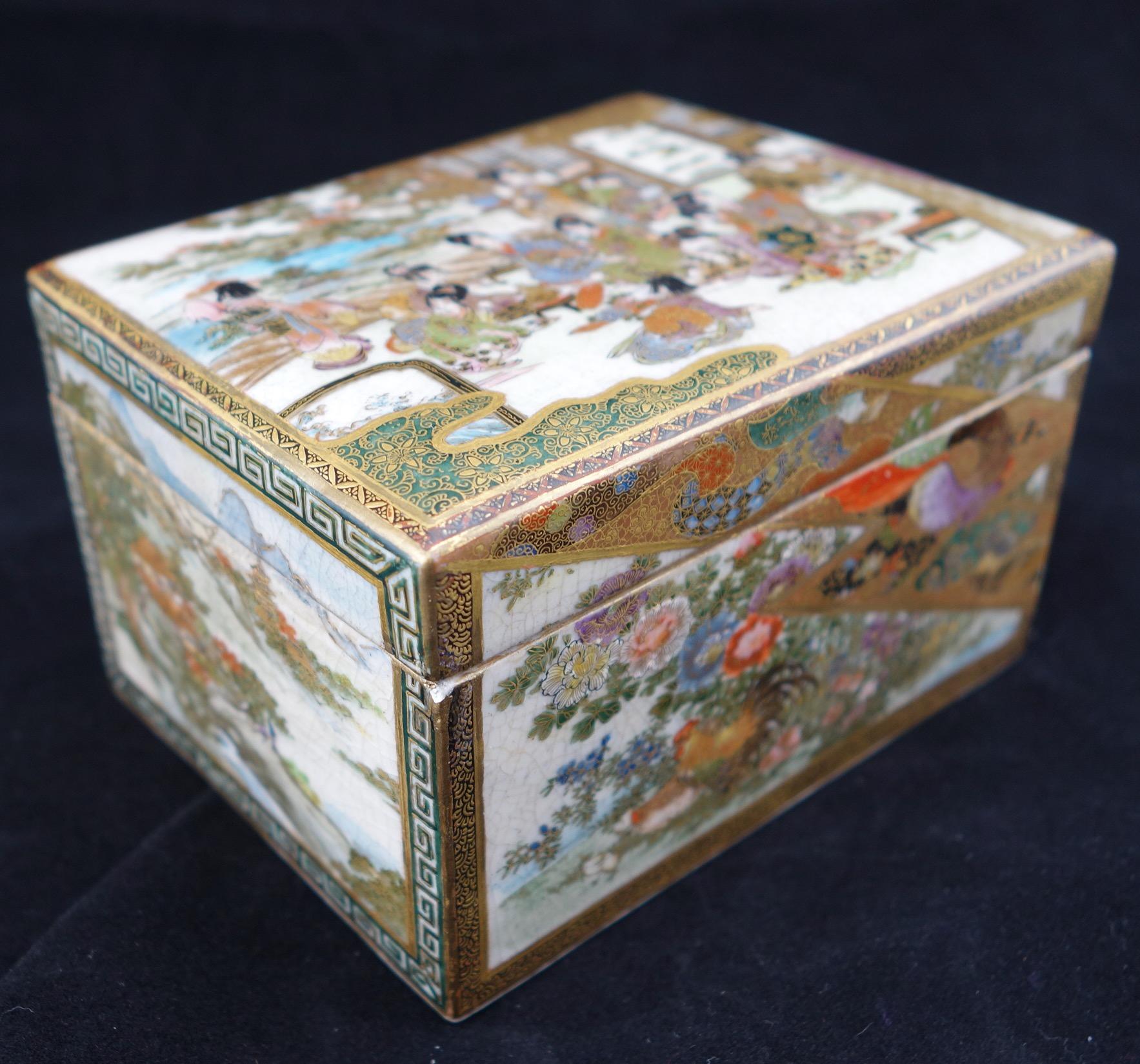 Japanese Meiji satsuma finely hand decorated and gilded box. The box depicts a different scene on each side. Marked with a maker's mark on the bottom.