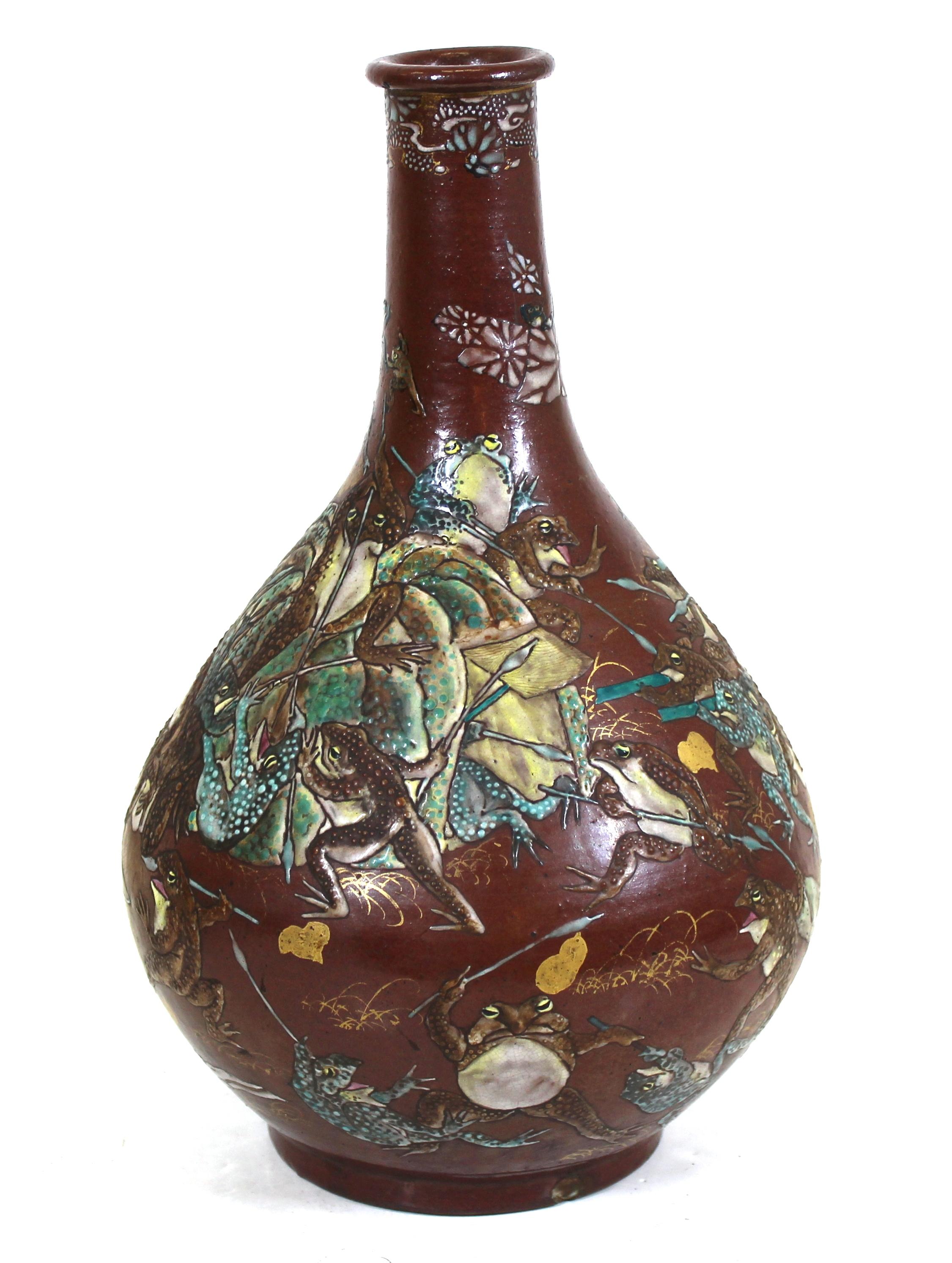 Japanese Meiji period satsuma vase depicting a colorful frieze of frogs at war, parcel gilt, with mark on bottom.