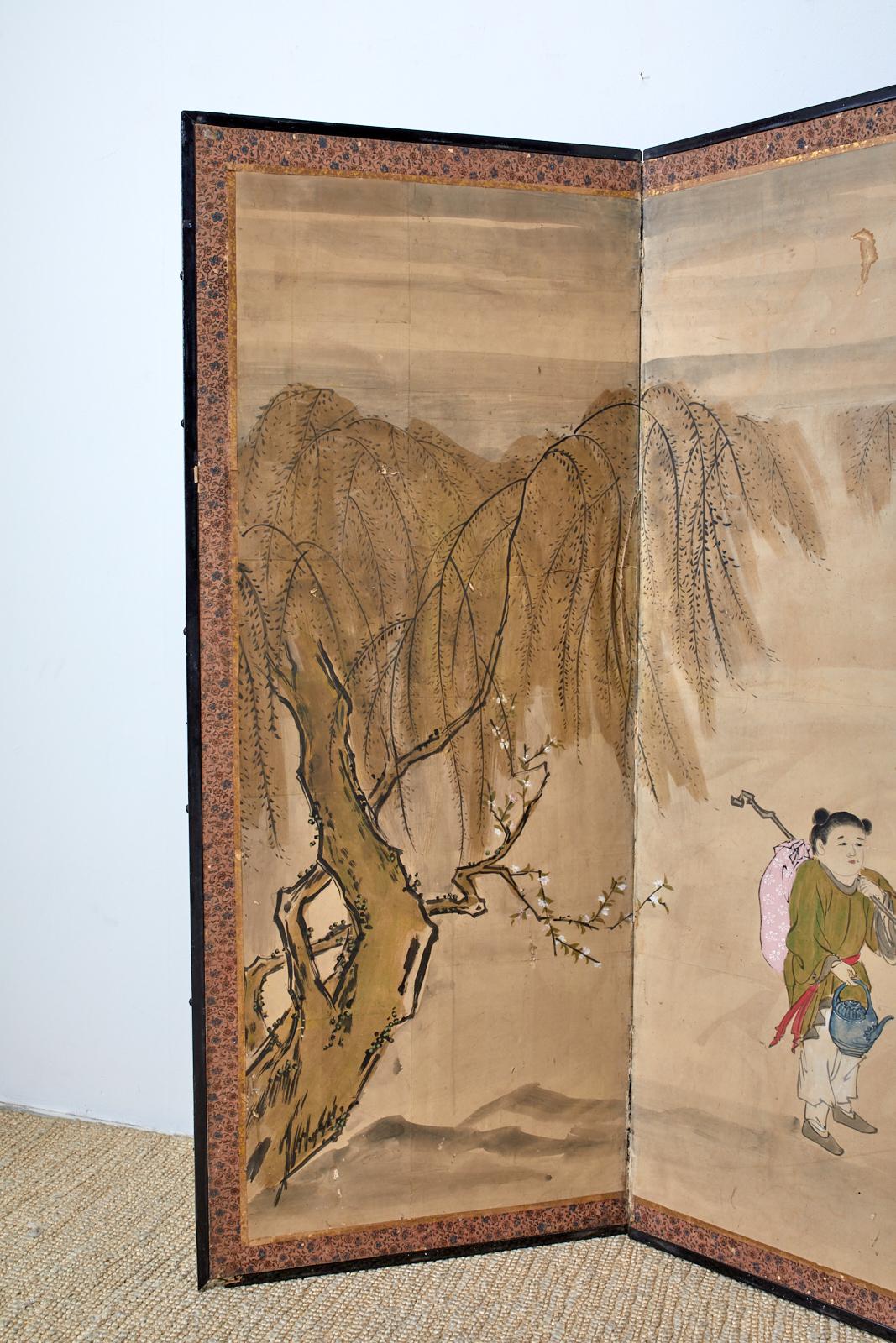 Large 19th century late Meiji period Japanese six-panel painted screen. Depicting a scholar and travelers encountering a Chinese sage riding a donkey. Inscribed with a cursive script poem in the middle. Beautifully faded and aged patina. Ink and