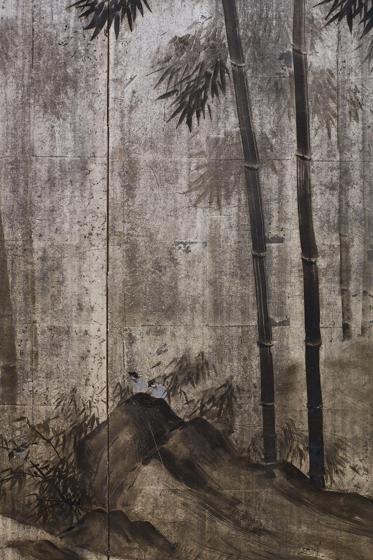 Rare Japanese Meiji period screen with Sumi-e ink on squares of silver leaf. Features a dark bamboo forest with quail. Sumi-e is the ancient art of Japanese monochromatic ink painting that has its origins in Chinese calligraphy. Set in an ebonized