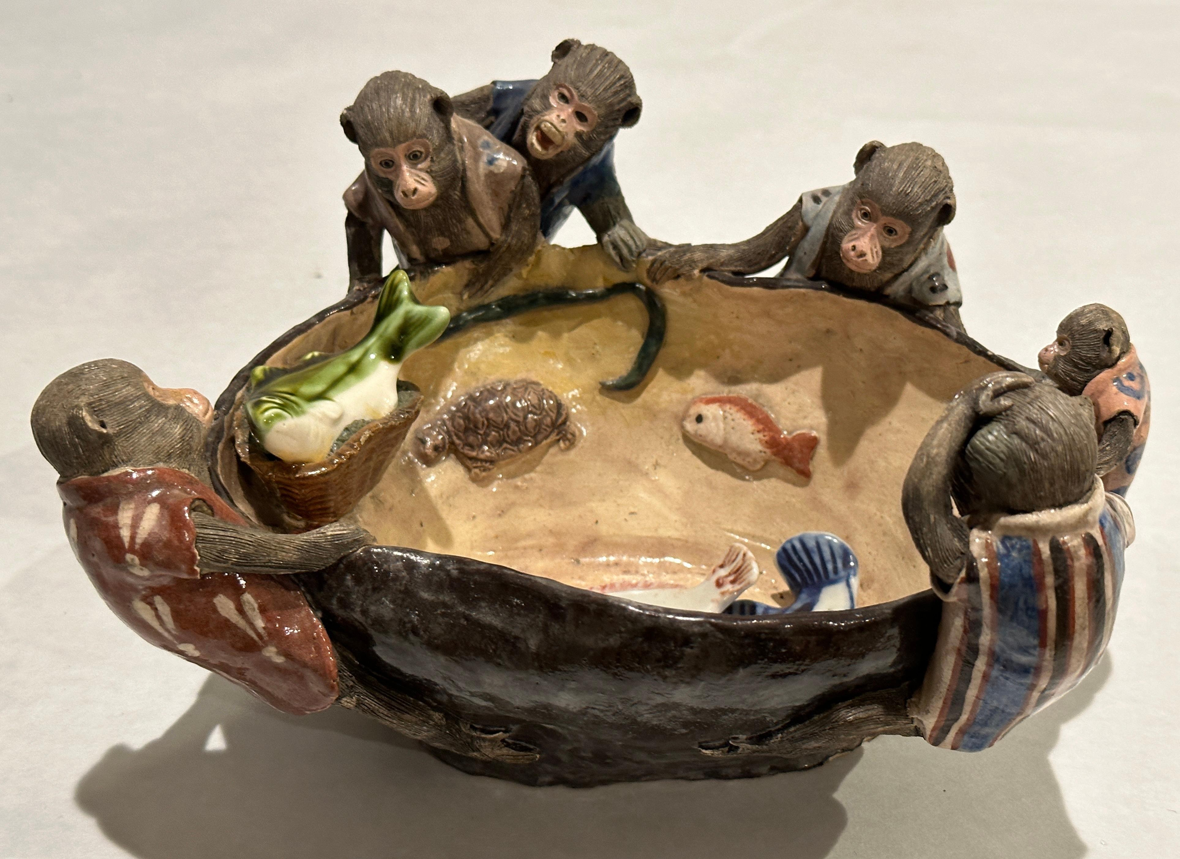 Fine example and splendid work of art from the Sumida Gawa pottery. Highly desirable image and type.
It is a heavy pottery with highly detailed applied figures of monkeys gazing with different expressions into a pond with fish and a turtle. Many