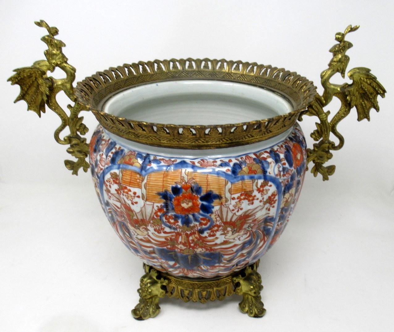 Very fine example of an unusually large and heavy bronze doré mounted Japanese Imari Porcelain jardinière of outstanding quality, late 19th-early 20th century. 

The bulbous ribbed body is hand painted in the typical Imari Palette in colours of