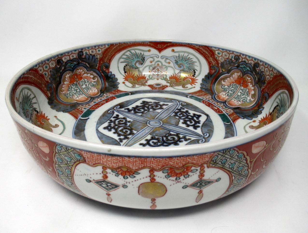 Stunning large Japanese Imari circular deep dish or centerpiece of outstanding quality, made during the last quarter of the 19th century. 

Hand decorated with all over typical decorative Imari palette in colours of iron red dark blue on an off