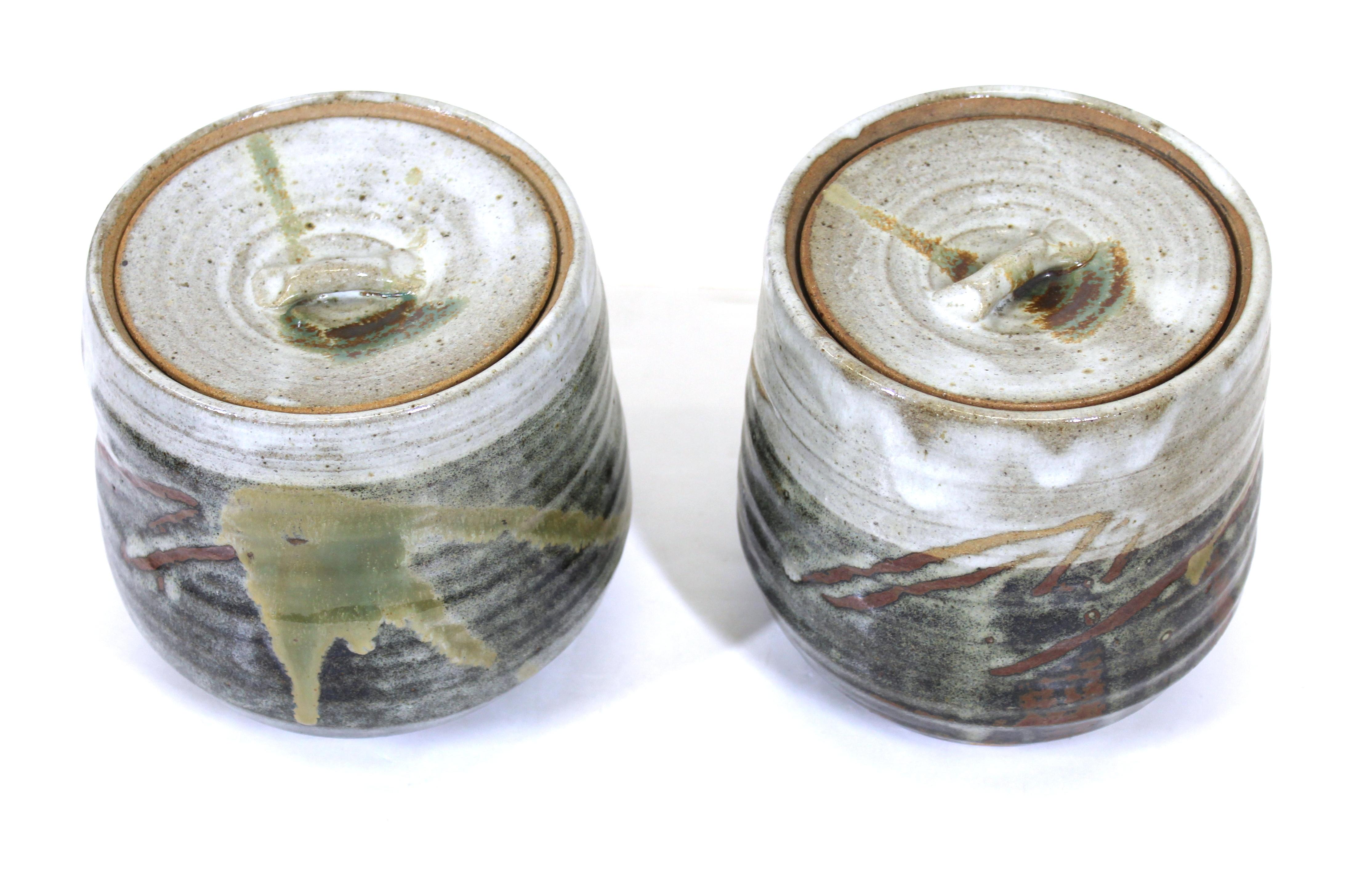 Japanese Mid-Century Modern art studio ceramic lidded jars with rich glaze, unsigned.