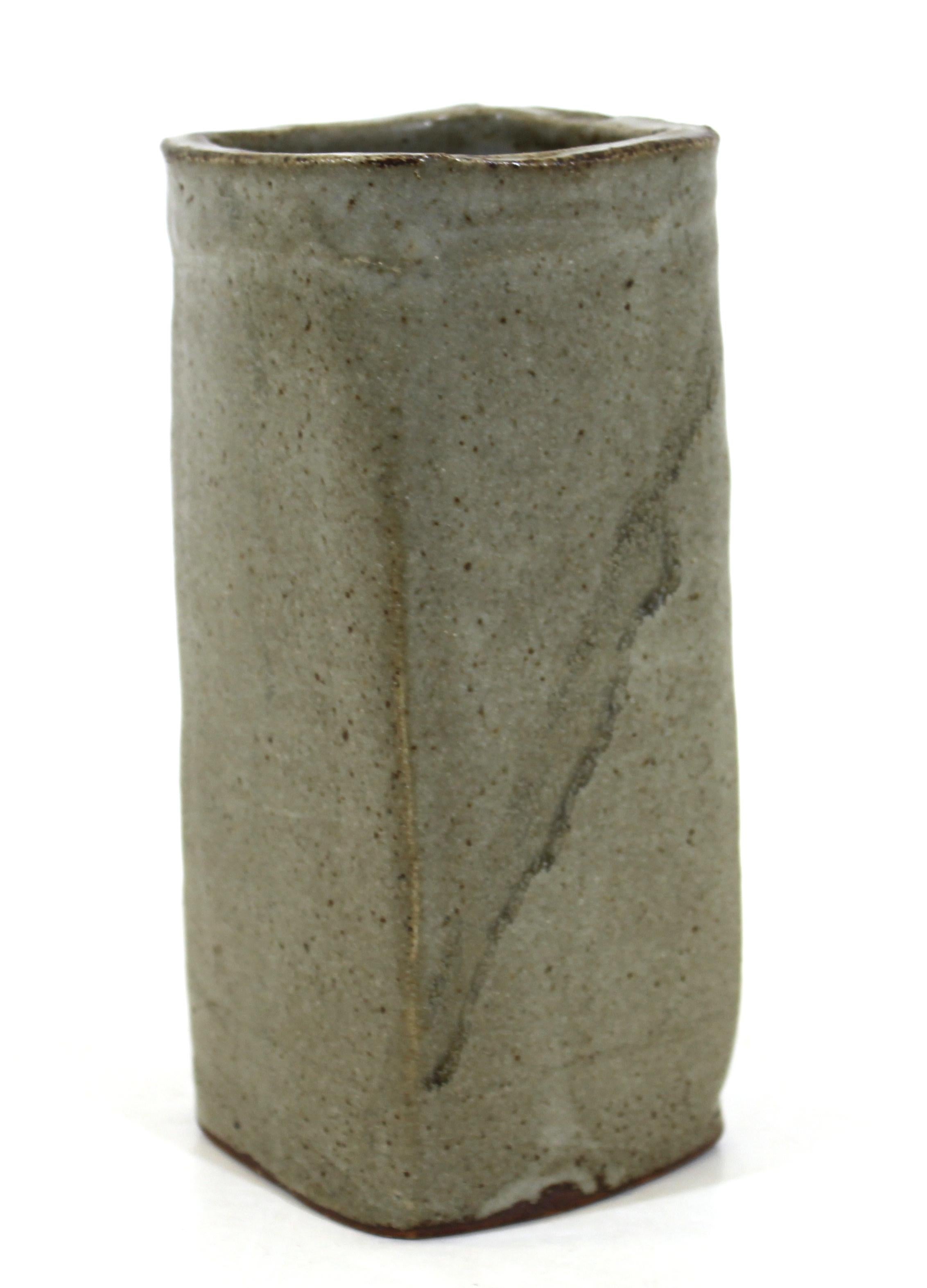 Japanese Mid-Century Modern art studio ceramic vase with square base and natural glaze, illegible mark on the bottom.
