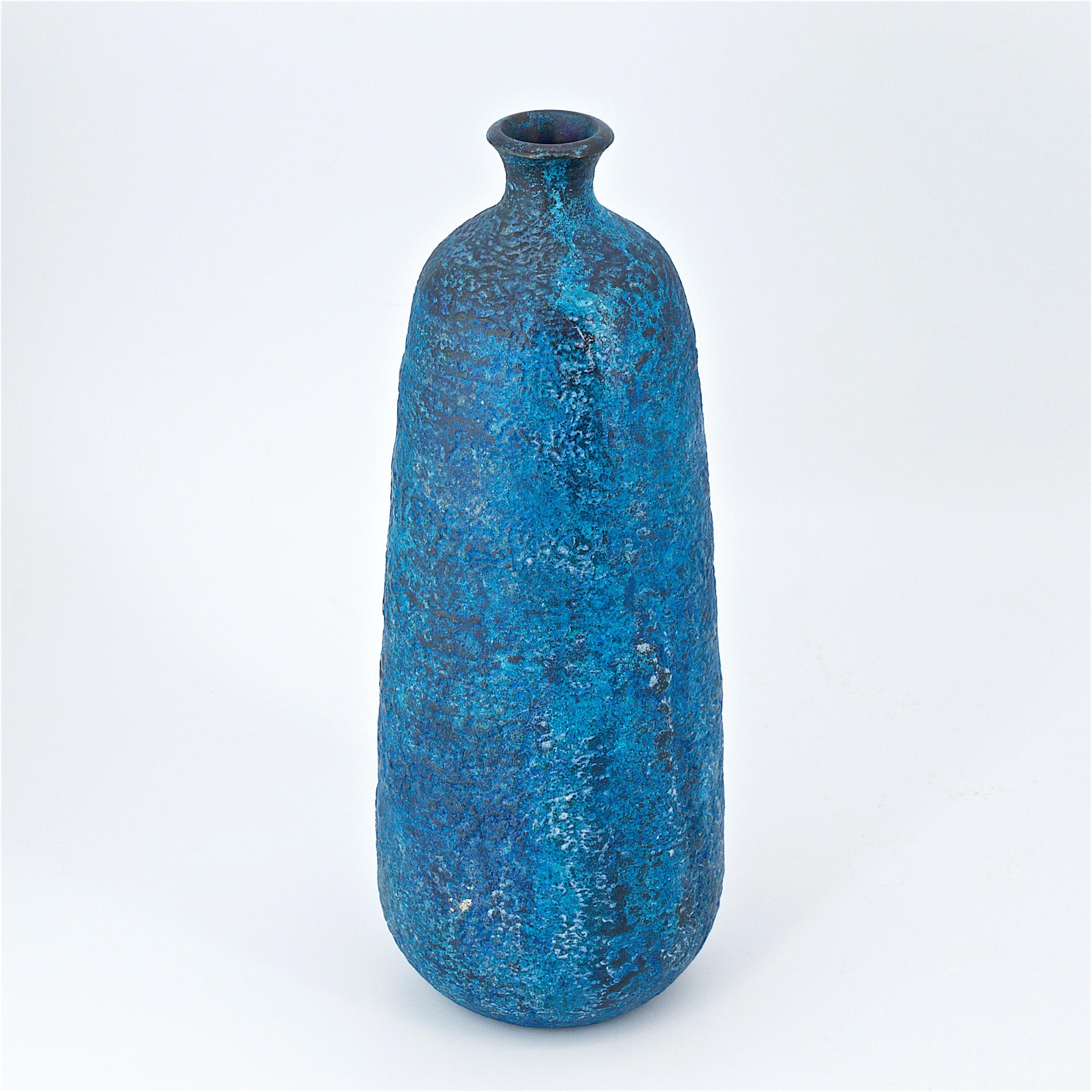 Spectacular Japanese vase. We have never had one quite like it! Super understated but with a vibrant blue glaze! Mottled or Volcanic textured enamel over Bronze. The glaze consists of; royal blue, cobalt blue, turquoise, black, and white. Very heavy