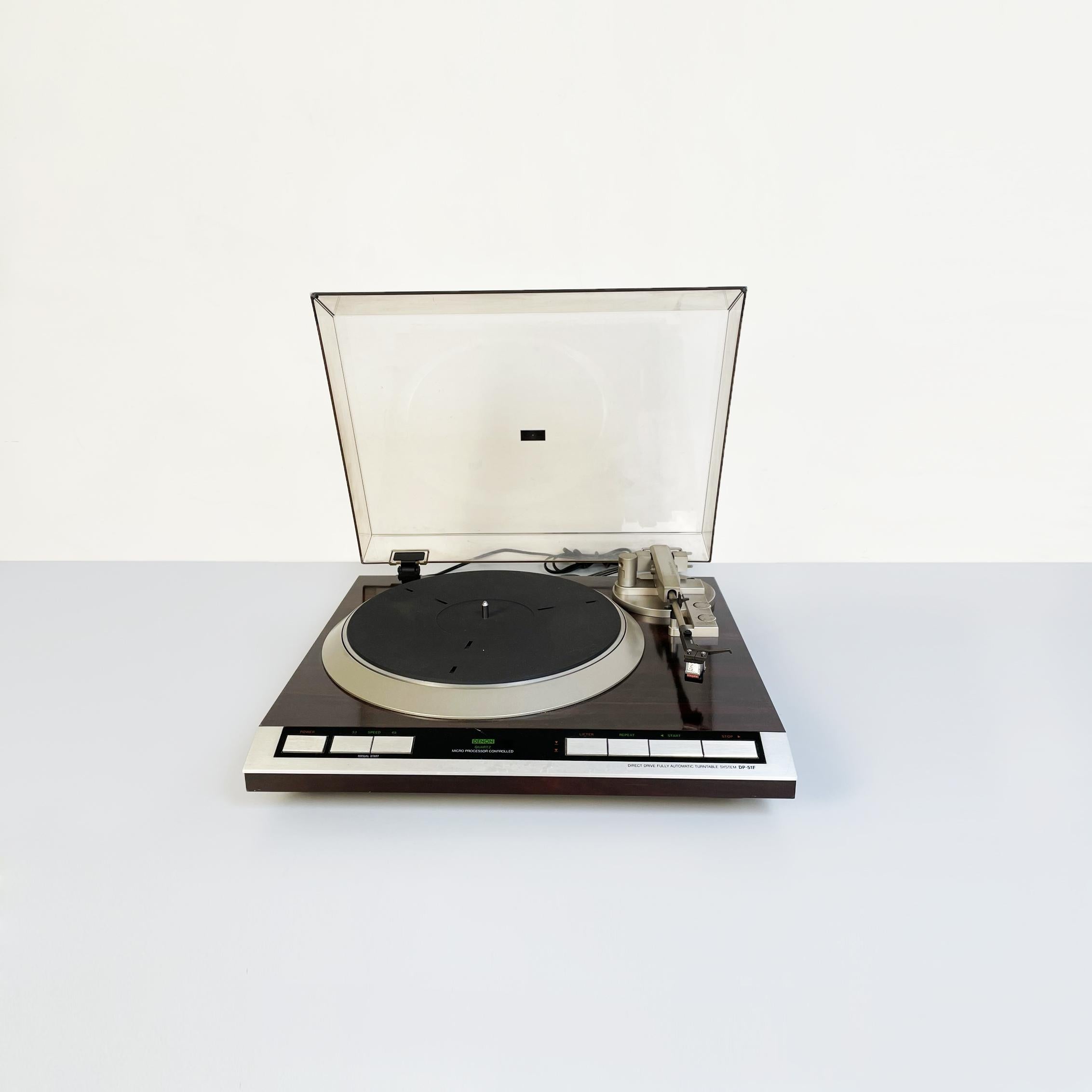 Japanese Mid-Century Modern Direct drive turntable by Denon Marke, 1980s
Japanese direct drive turntable model Quartz lock micro processor controlled turntable DP-45F in wood and aluminum with plastic cover for 45 and 33 rpm vinyls, fully