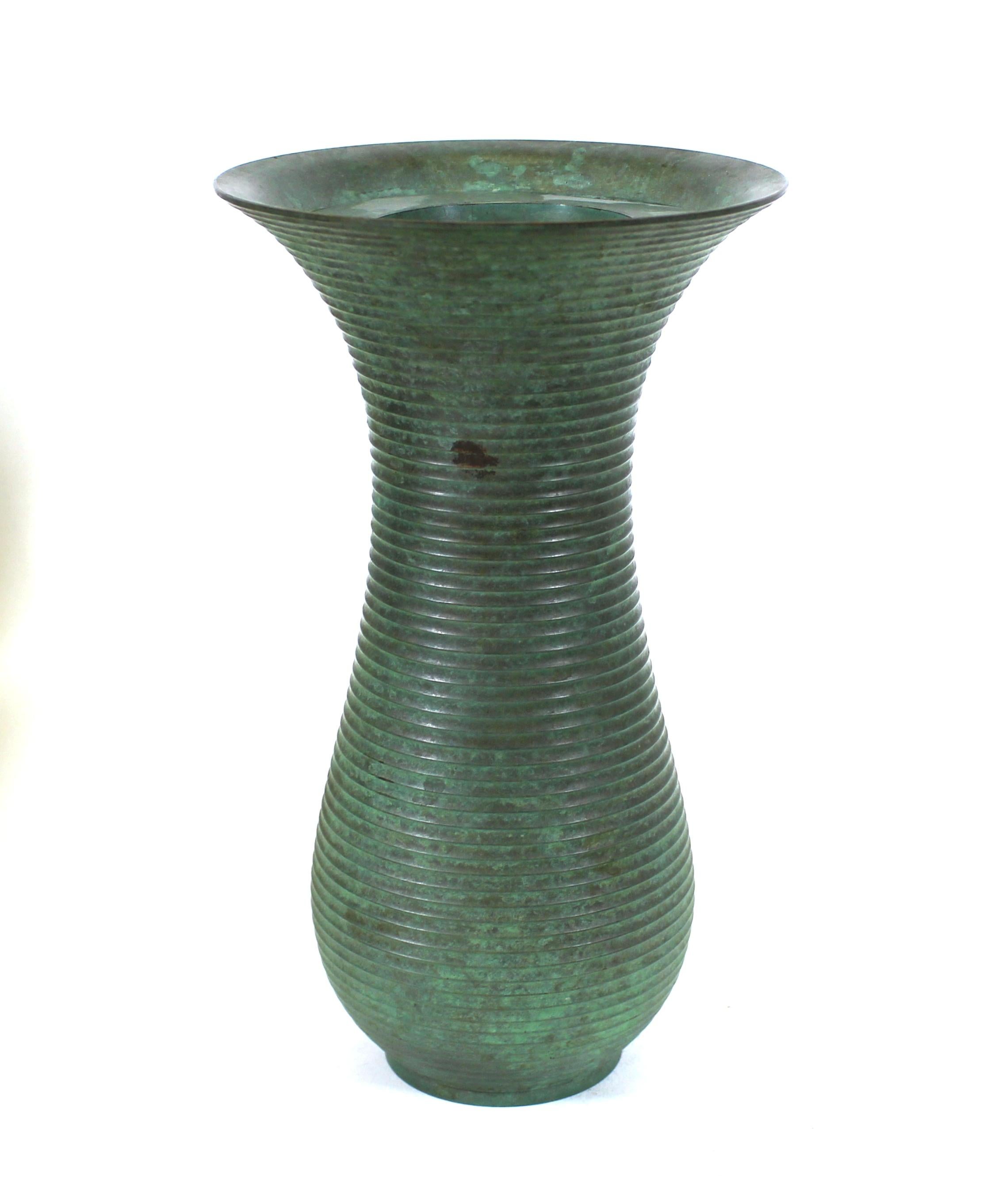 Japanese Mid-Century Modern ribbed metal ikebana vase with green patina.