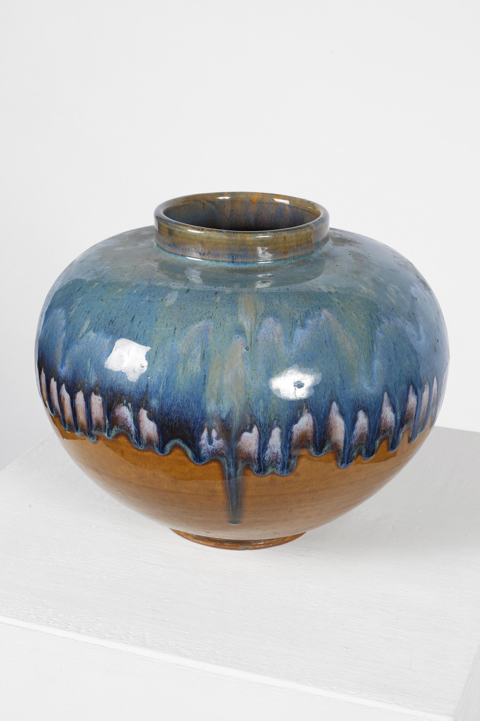 A large Shōwa era ceramic vase with mottled blue and tan drip glaze. Japanese, c. 1960s.
