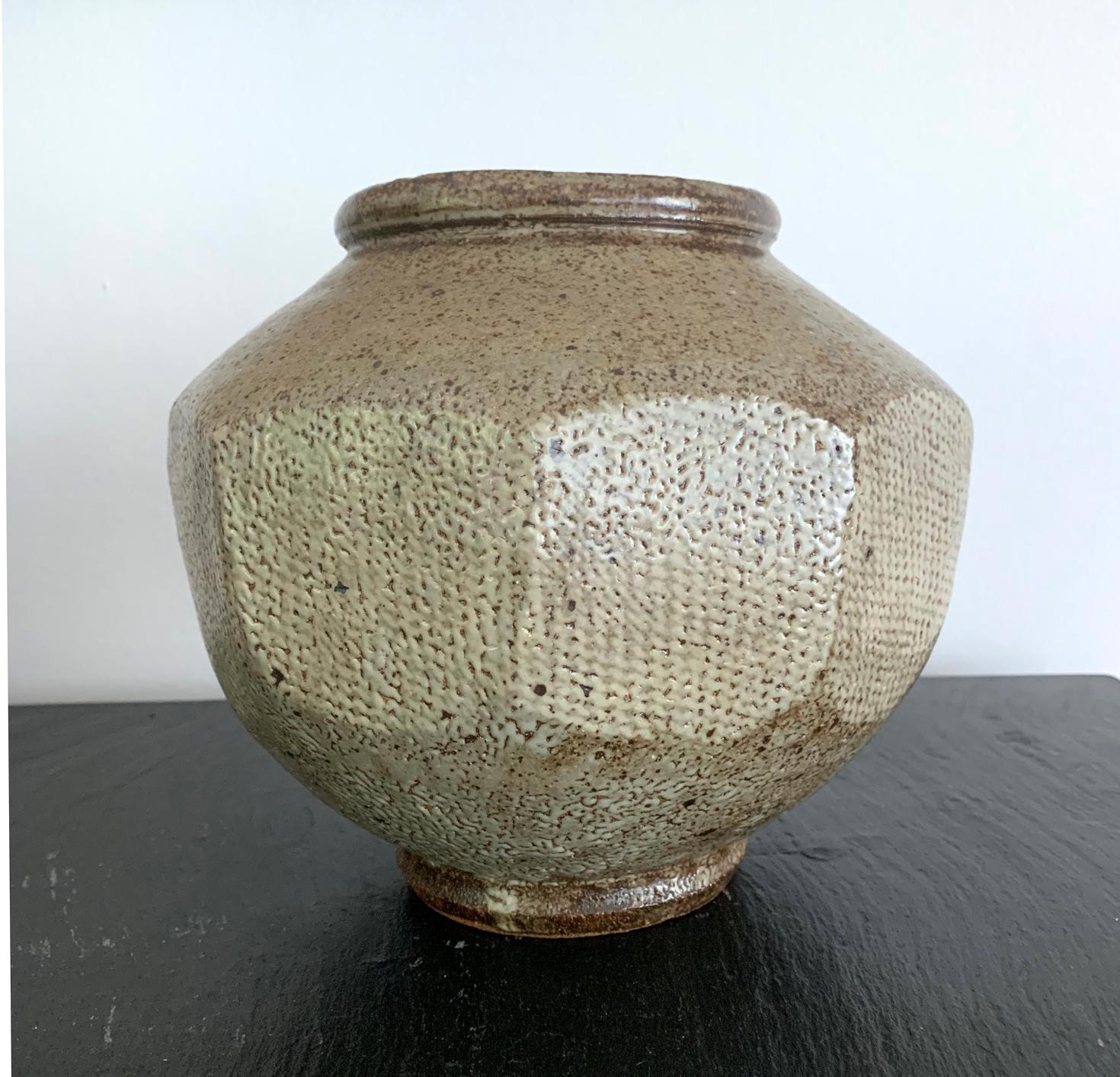 A handsome Japanese ceramic stoneware storage jar attributed to Tatsuzo Shimaoka (1919-2007), an important member in Japanese Mingei folk art movement. This piece of pottery is made in typical unique Jomon zogan style for which the artist was known