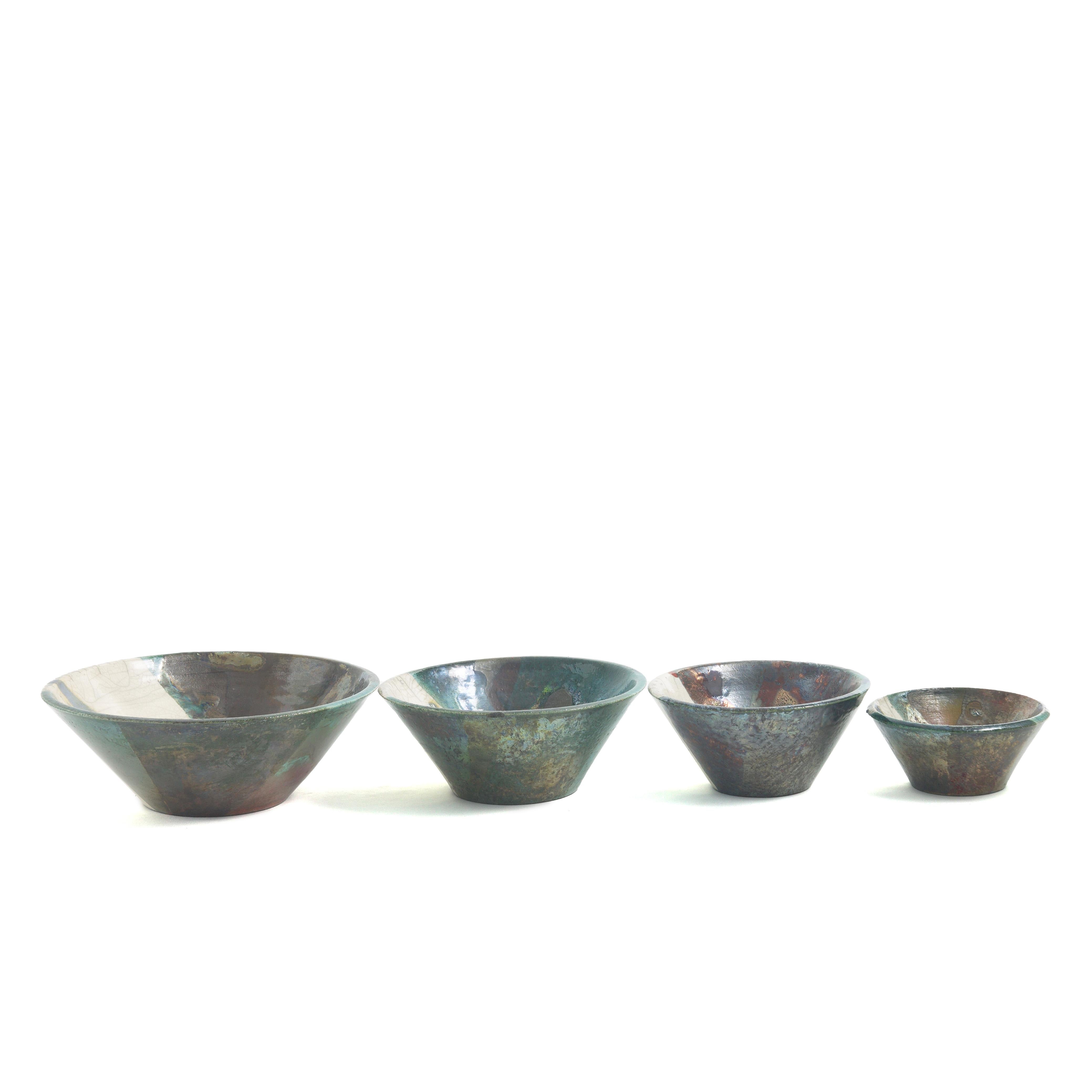Aurora Set Of 4 Bowls

This superb set of four bowls actualizes a refined synthesis between abstract art and impeccable craftsmanship, resulting in a functional design that is sure to impress whatever the use. Handcrafted following the ancient