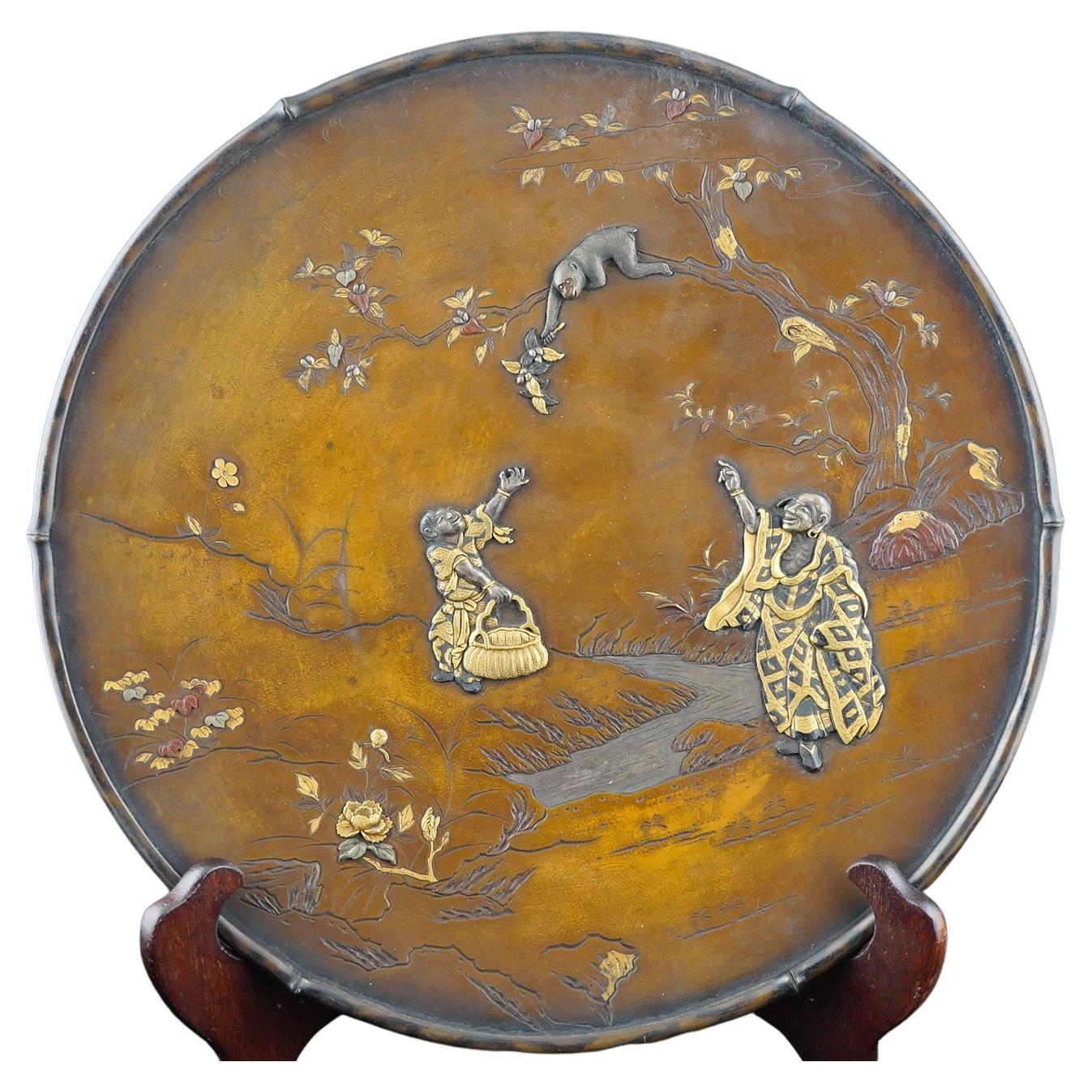 Japanese Mixed Metal Finely Executed Decorative Plate of Monkey Picking Fruit For Sale