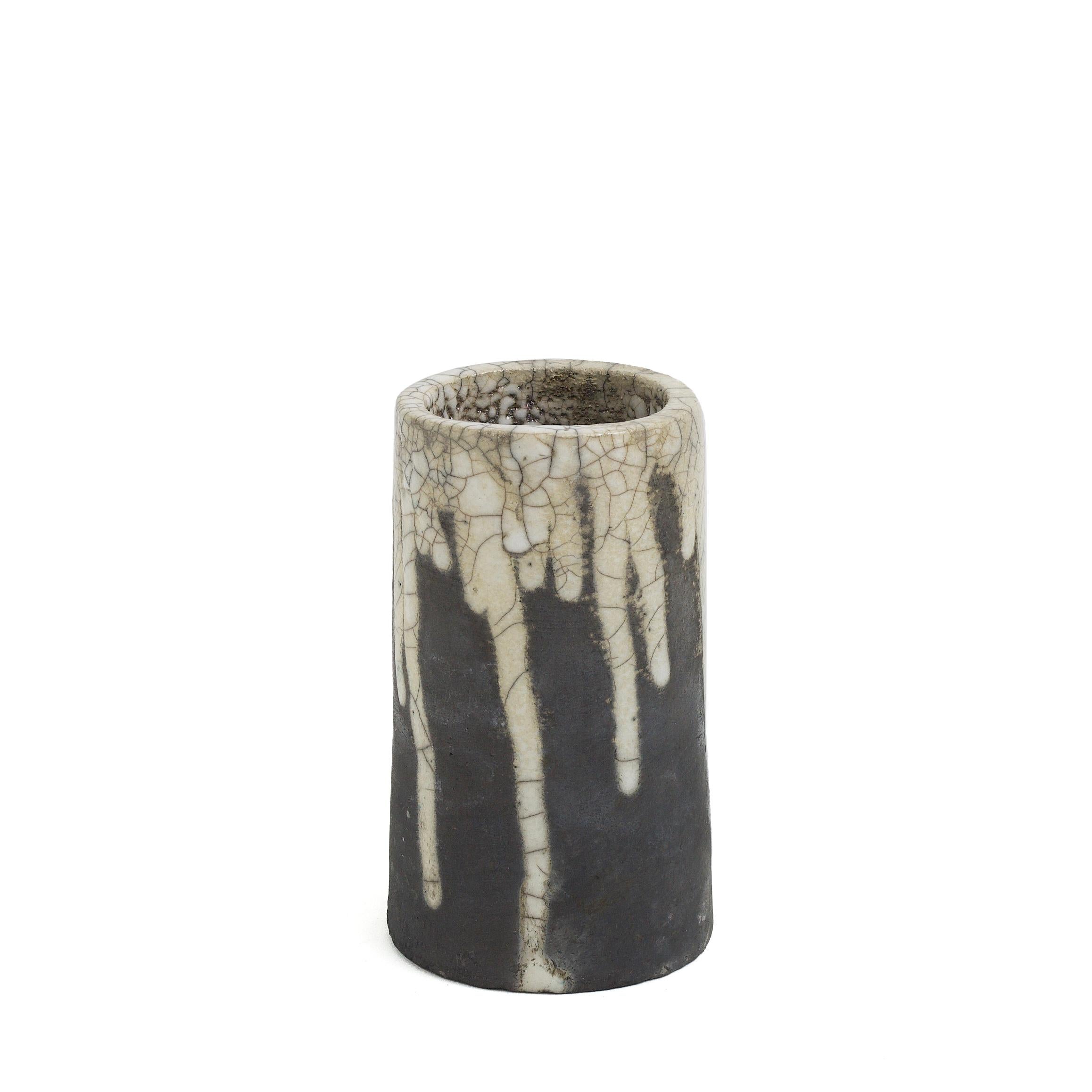 Magma pen holder

A movement frozen in time like the magma solidifed in obisidian. Result of a sudden break in the heating process followed by a fast cooling down of the piece, this vase shows a solidified moment both on the outside where the