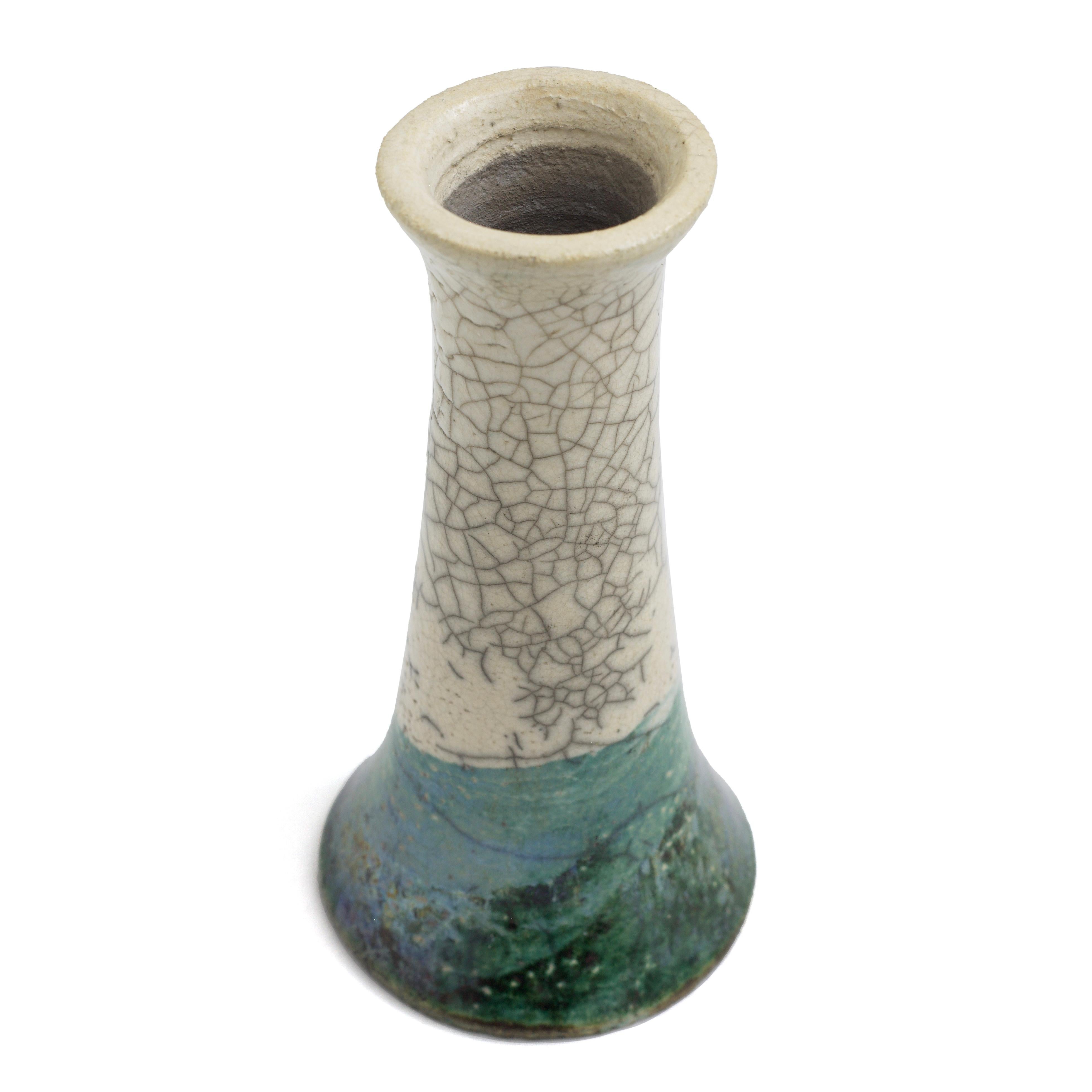 Stelo Flow Candle Holders

Captivating hues of bold visual impact make these two candle holders one-off pieces of unprecedented artistic charm. A stunning Raku crakle' effect on the top and a cut at the bottom by a 