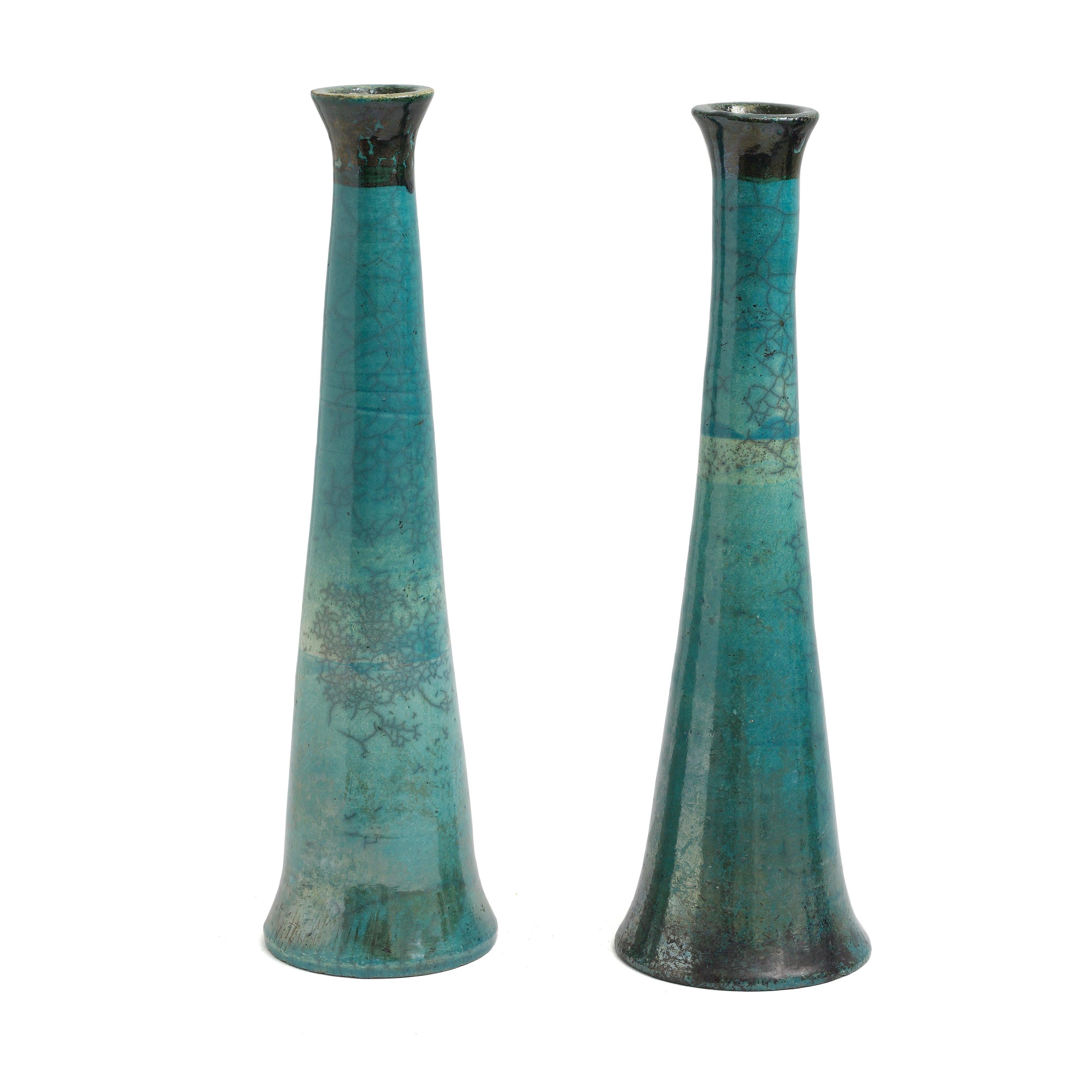 Tamu candle holders

A metallic effect cover these two tall candle holders so masterfully crafted that these pieces have a mirror effect along their entire bodies. Different shades of green and turquoise contained by a shiny black top and a