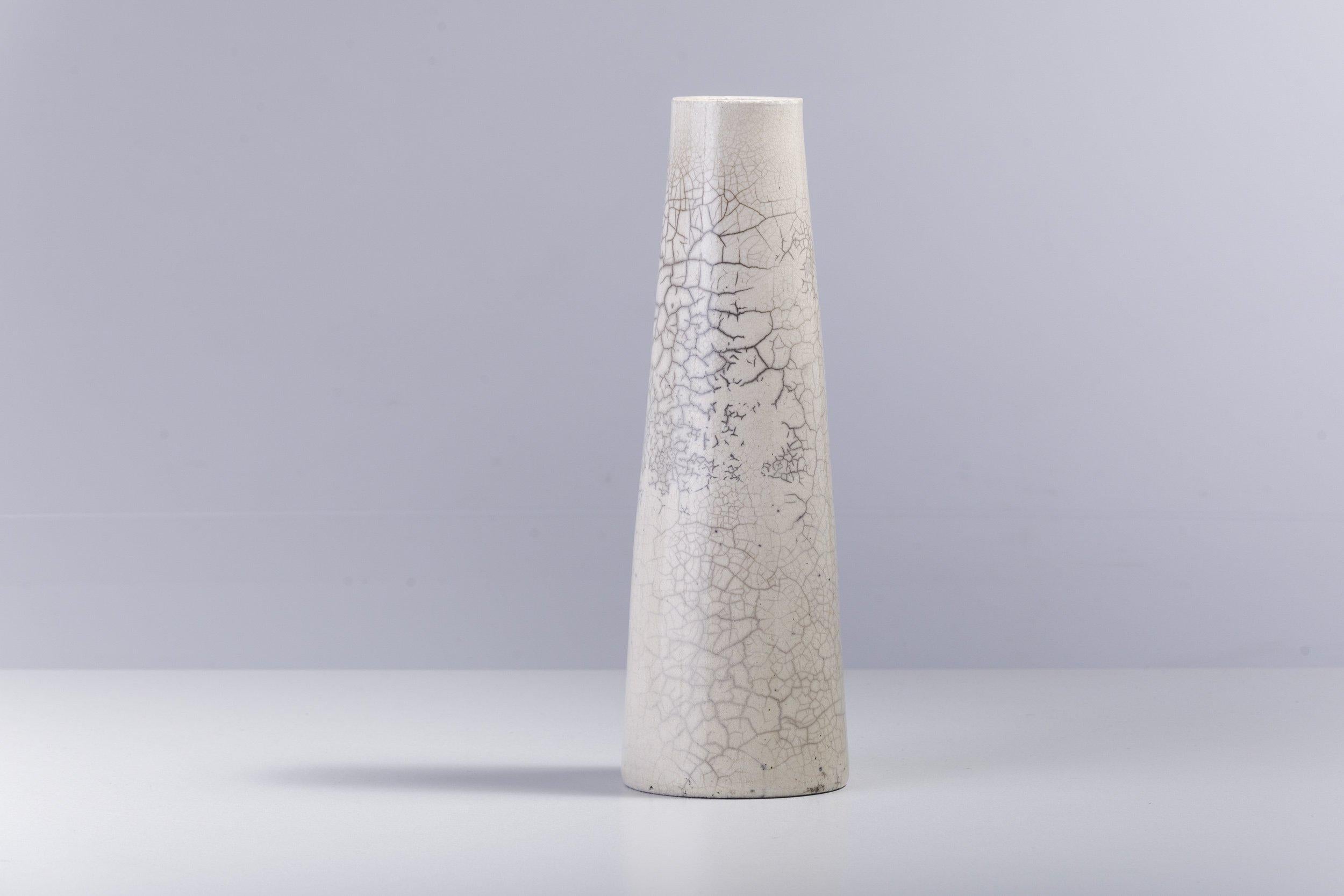 Hana vertical L

The perfect, stylish addition to any interior setting, this extraordinary vase is entirely handcrafted of ceramic following the ancient Raku technique of Japanese origins. The naturally colored, sleek surface of this artwork is